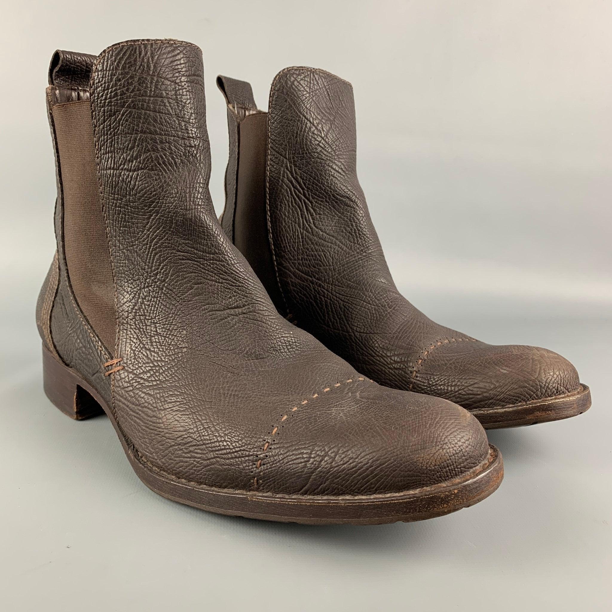 HENRY BEGUELIN boots comes in a brown leather featuring a chelsea style, contrast stitching, cap toe, and a wooden sole. Made in Italy.Good
Pre-Owned Condition. 

Marked:   43 

Measurements: 
  Length: 12 inches  Width: 4 inches  Height: 6.5 inches