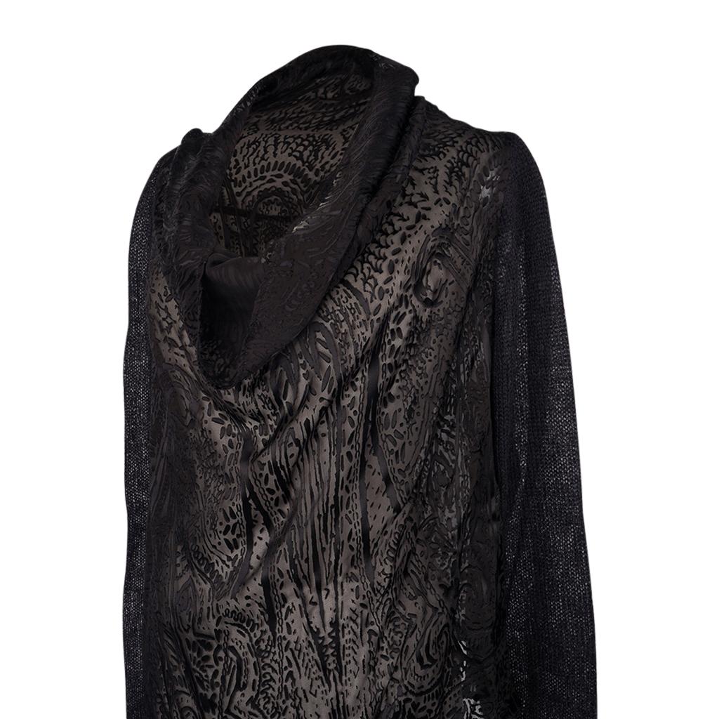 Henry Beguelin Black semi sheer relaxed cowl neck long sleeve asymmetrical top.
Deconstructed top with a cowl neck that has a tie inside to hold top in place.
Laser cut velvet abstract pattern of swirls and paisley in black atop a sheer finely woven