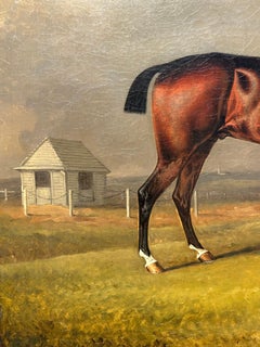 Cavallo da corsa inglese del XIX secolo a Newmarket con proprietario e stalliere in un paesaggio