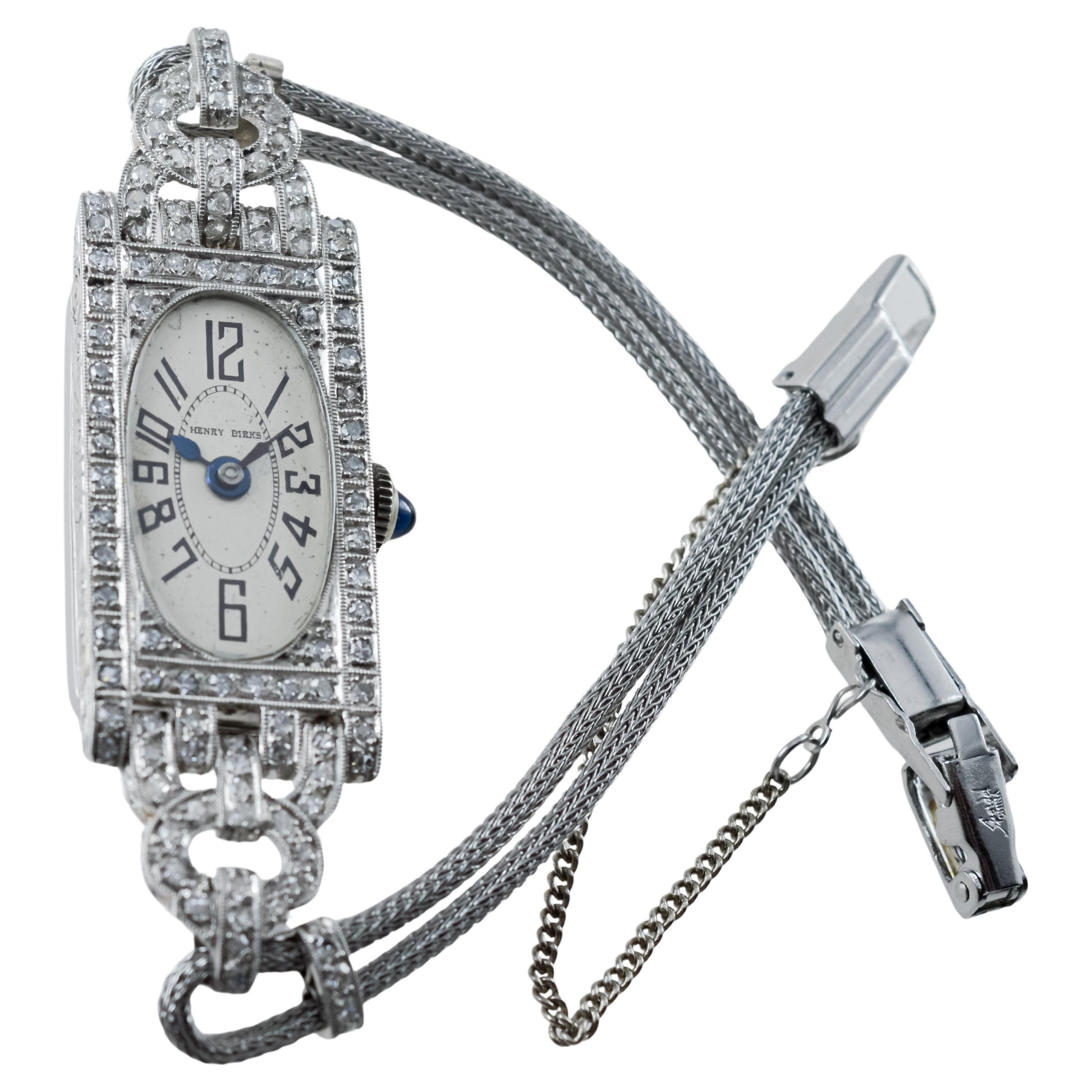 FACTORY / HOUSE: Henry Birks & Sons
STYLE / REFERENCE: Art Deco / Diamond Dress Watch
METAL / MATERIAL: Platinum / Metal Cord Band
CIRCA / YEAR: 1930's
DIMENSIONS / SIZE: Length 55m X Width 16mm
MOVEMENT / CALIBER: Manual Winding / 18 Jewels  
DIAL