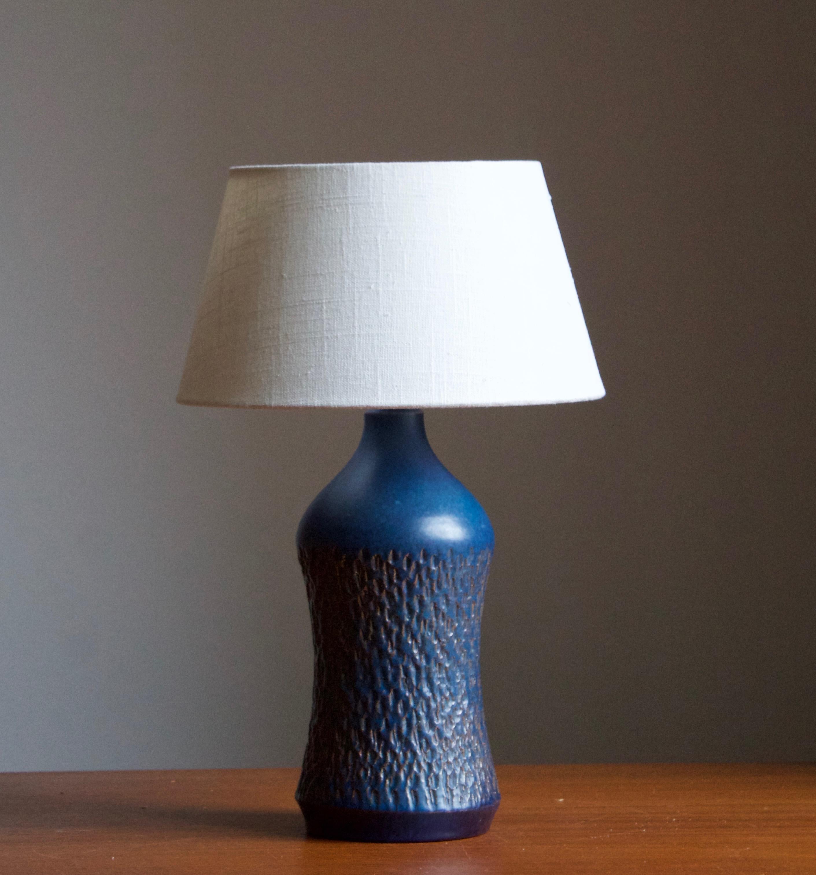 A stoneware table lamp designed by Henry Brandi, and produced by his own firm, Brandi Vejbystrand, Sweden, 1960s. Marked and labeled. 

Stated dimensions exclude lamsphade. Height includes socket. The lampshade is not included in the