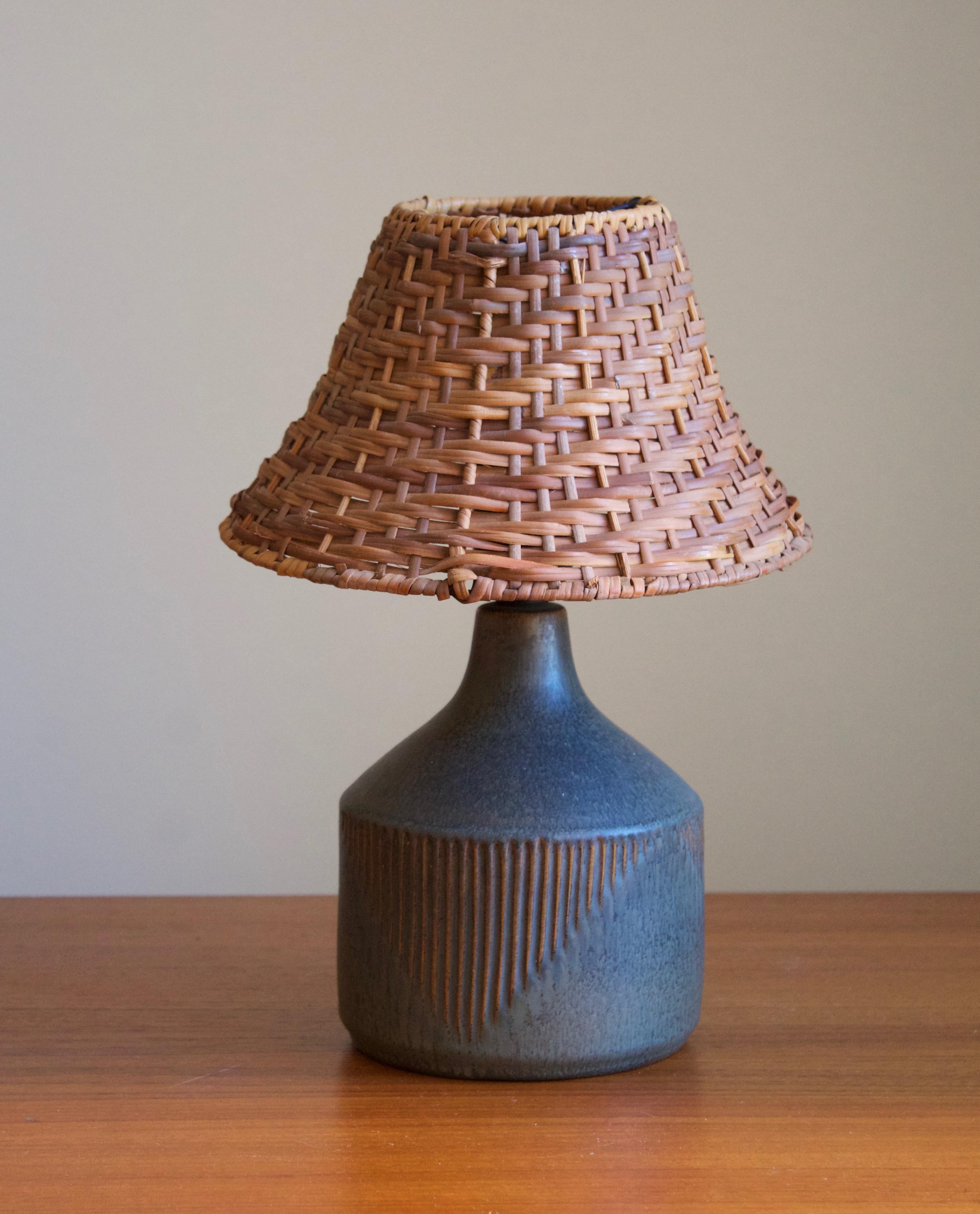 A stoneware table lamp designed by Henry Brandi, and produced by his own firm, Brandi Vejbystrand, Sweden, 1960s. Marked and labeled. 

Stated dimensions exclude lamsphade. Height includes socket. Upon request illustrated lampshade can be included