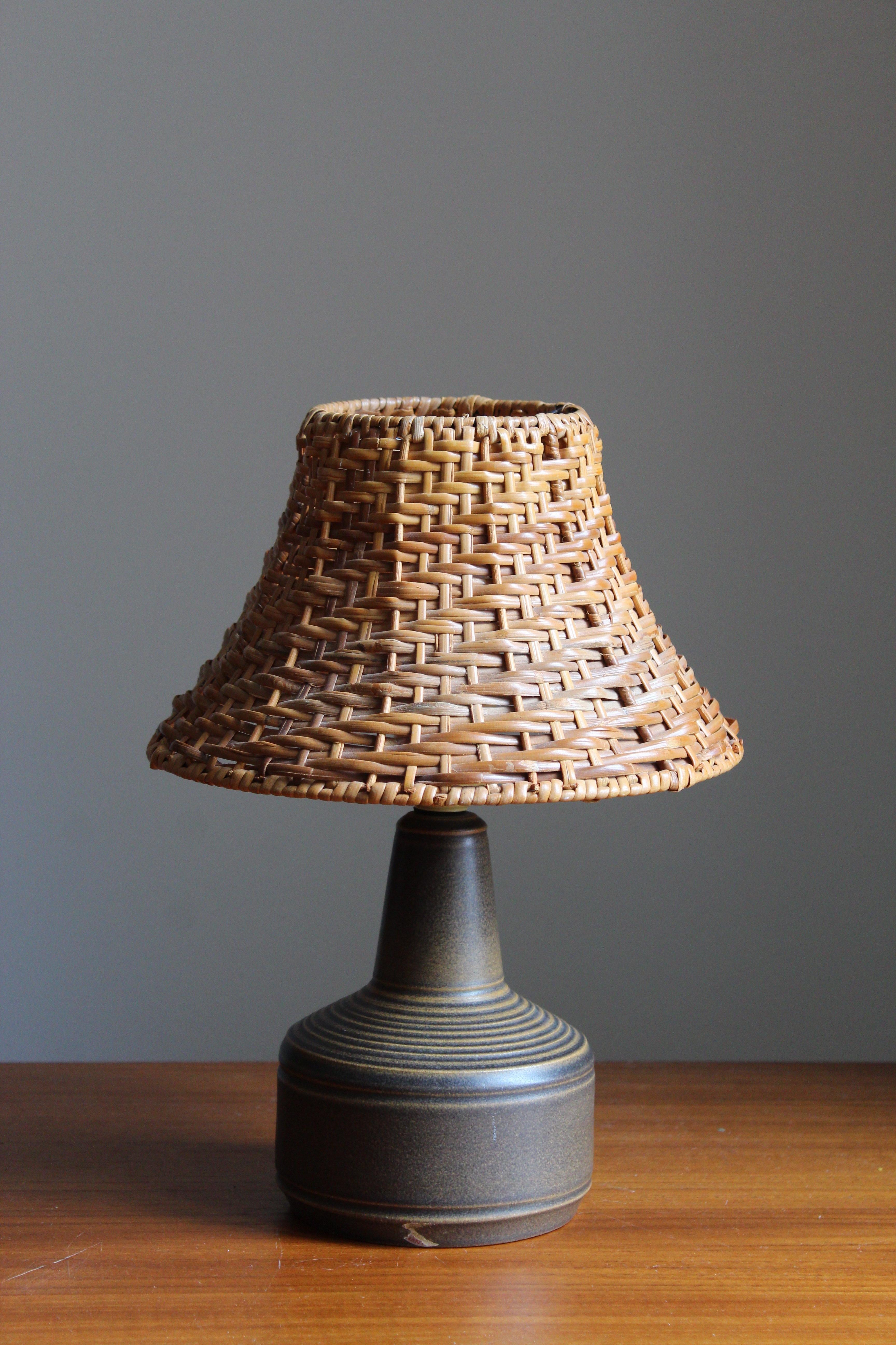 A stoneware table lamp designed by Henry Brandi, and produced by his own firm, Brandi Vejbystrand, Sweden, 1960s. Marked and labeled. 

Stated dimensions exclude lamsphade. Height includes socket. Upon request illustrated lampshade can be included
