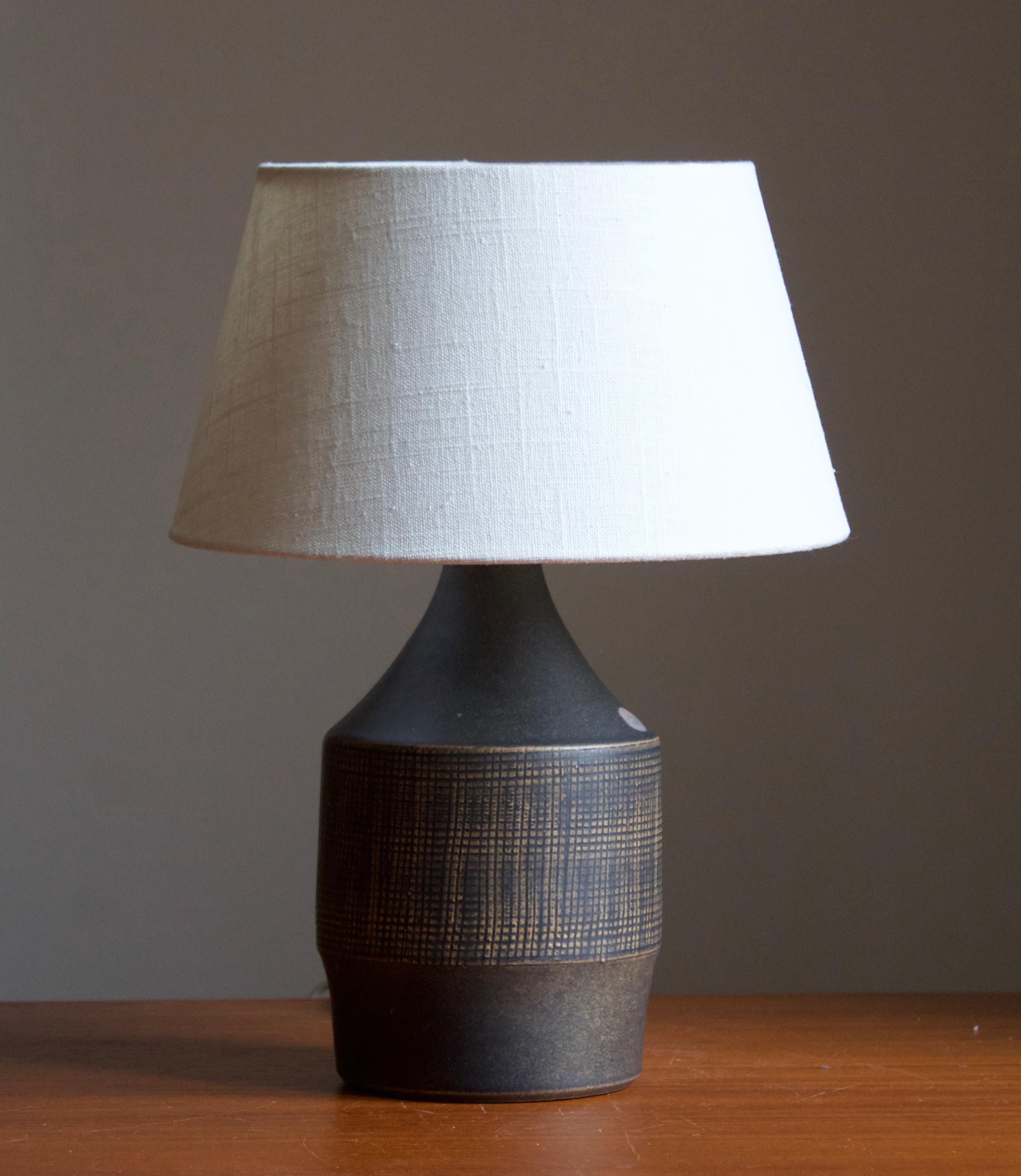A stoneware table lamp designed by Henry Brandi, and produced by his own firm, Brandi Vejbystrand, Sweden, 1960s. Marked and labeled. 

Stated dimensions exclude lamsphade. Height includes socket. Lampshade is not included in purchase.

Other
