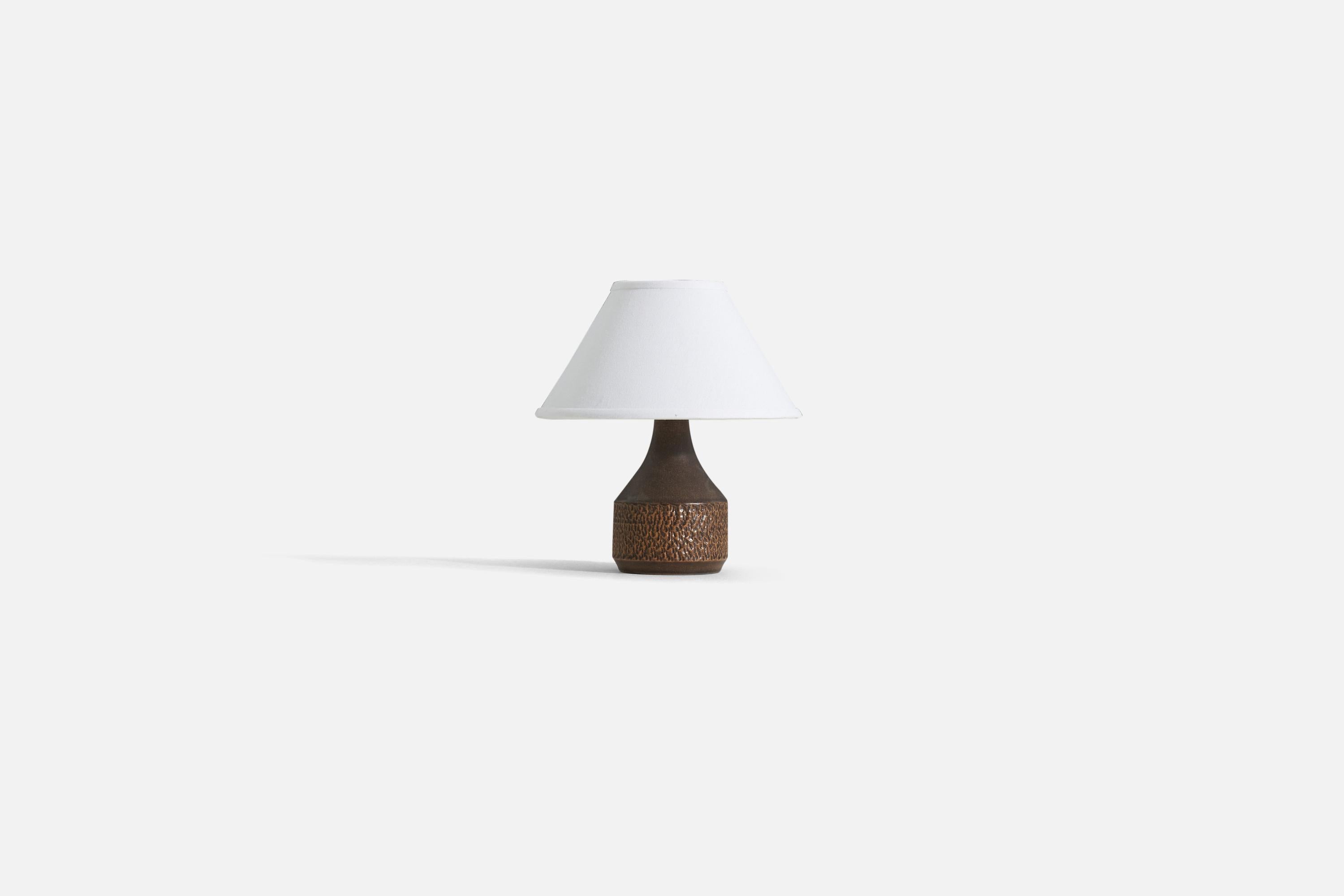 A stoneware table lamp designed by Henry Brandi, and produced by his own firm, Brandi Vejbystrand, Sweden, 1960s. It is marked and labeled. 

Sold without lampshade. 
Dimensions of Lamp (inches) : 8.25 x 4.5 x 4.5 (H x W x D)
Dimensions of Shade