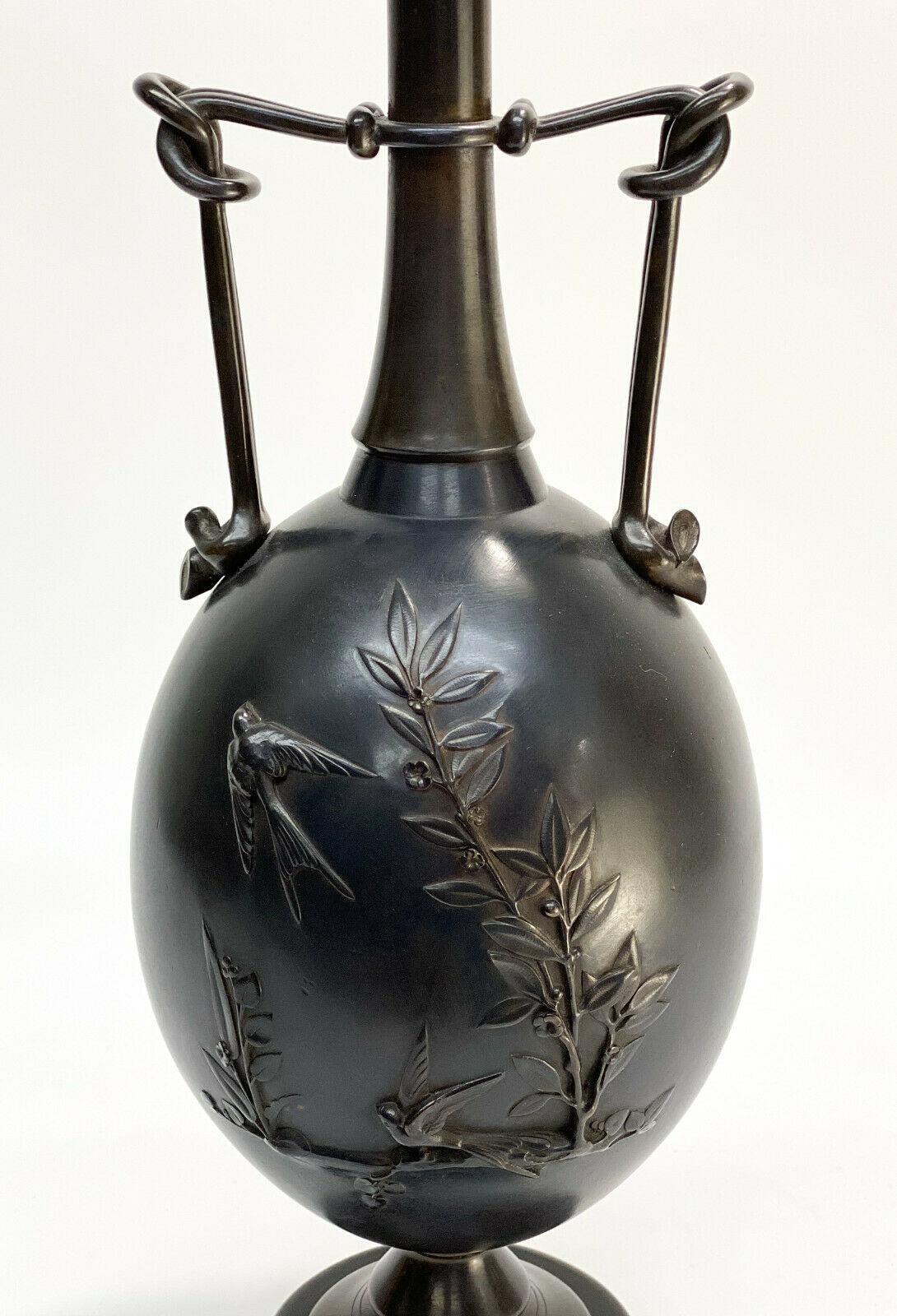 Henry Cahieux Barbedienne French Patinated Bronze Japonism Twin Handled Urn

Late 19th Century. The central areas depicting Japanese style raised birds and leaves in a marsh landscape. Signed Barbedienne towards the base to one side and H. Cahieux
