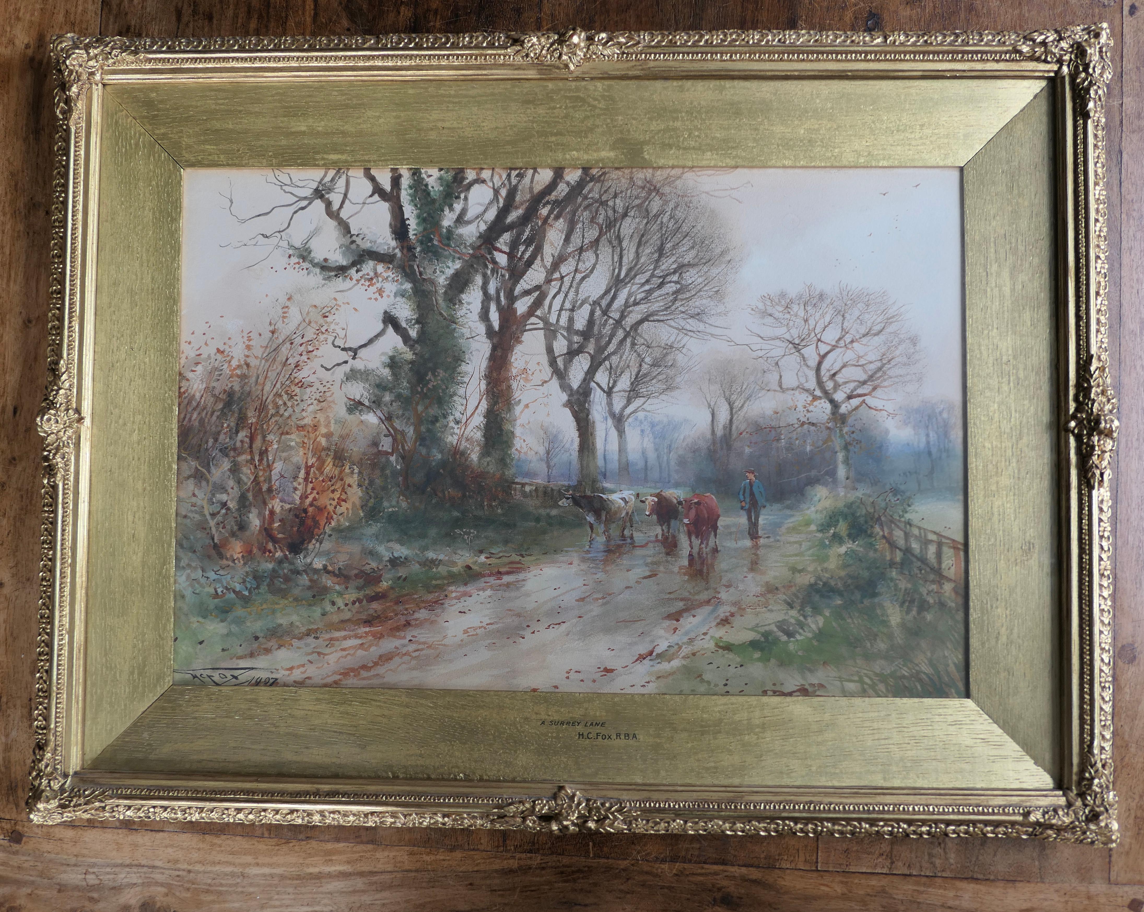 Henry Charles Fox R B A British 1855 1929. A Surrey Lane

This is a fine example of the Artists work signed and dated 1907. 
The scene is of a Cowman on a wet Surrey Lane in autumn

Fox was born in London in 1855. He exhibited at the Royal Academy