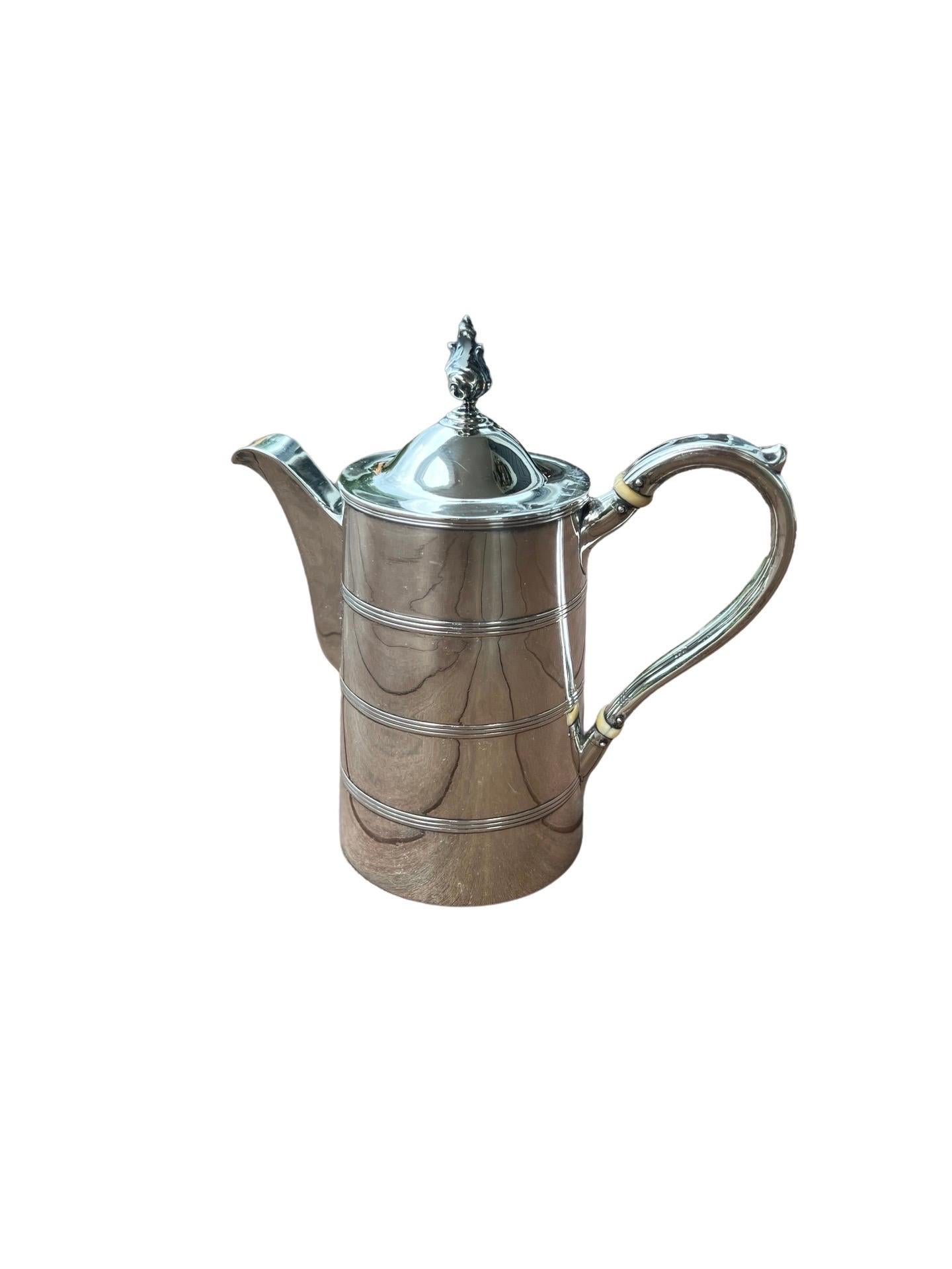 Henry Chawner Antique George III Sterling Silver Teapot Circa 1794

Beautiful 18th century Georgian silver teapot in a tankard style stacked form, hefty spout and ivory insulators to handle. Fully marked to bottom. Weight approx: 20 OZT
There is an