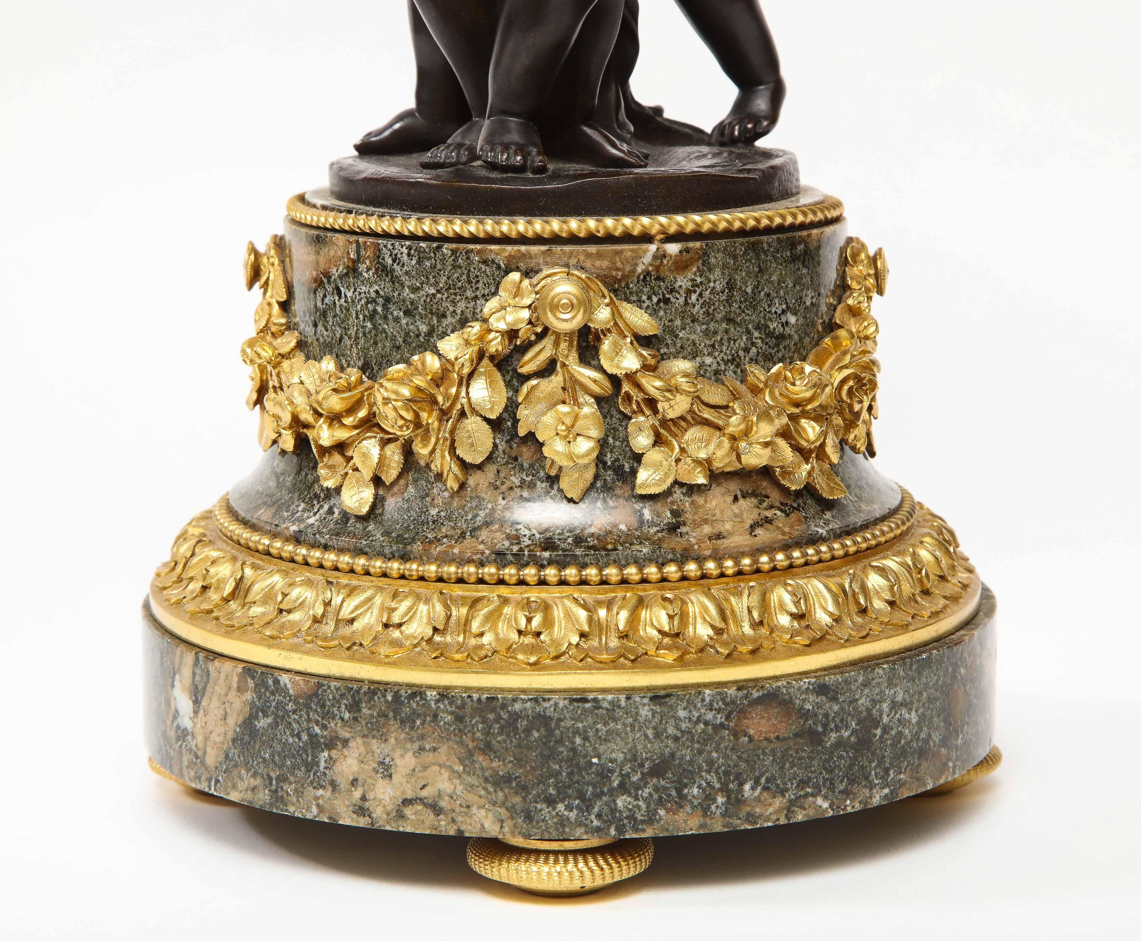 Henry Dasson, a French Gilt and Patinated Bronze Marble and Enamel Annular Clock 3