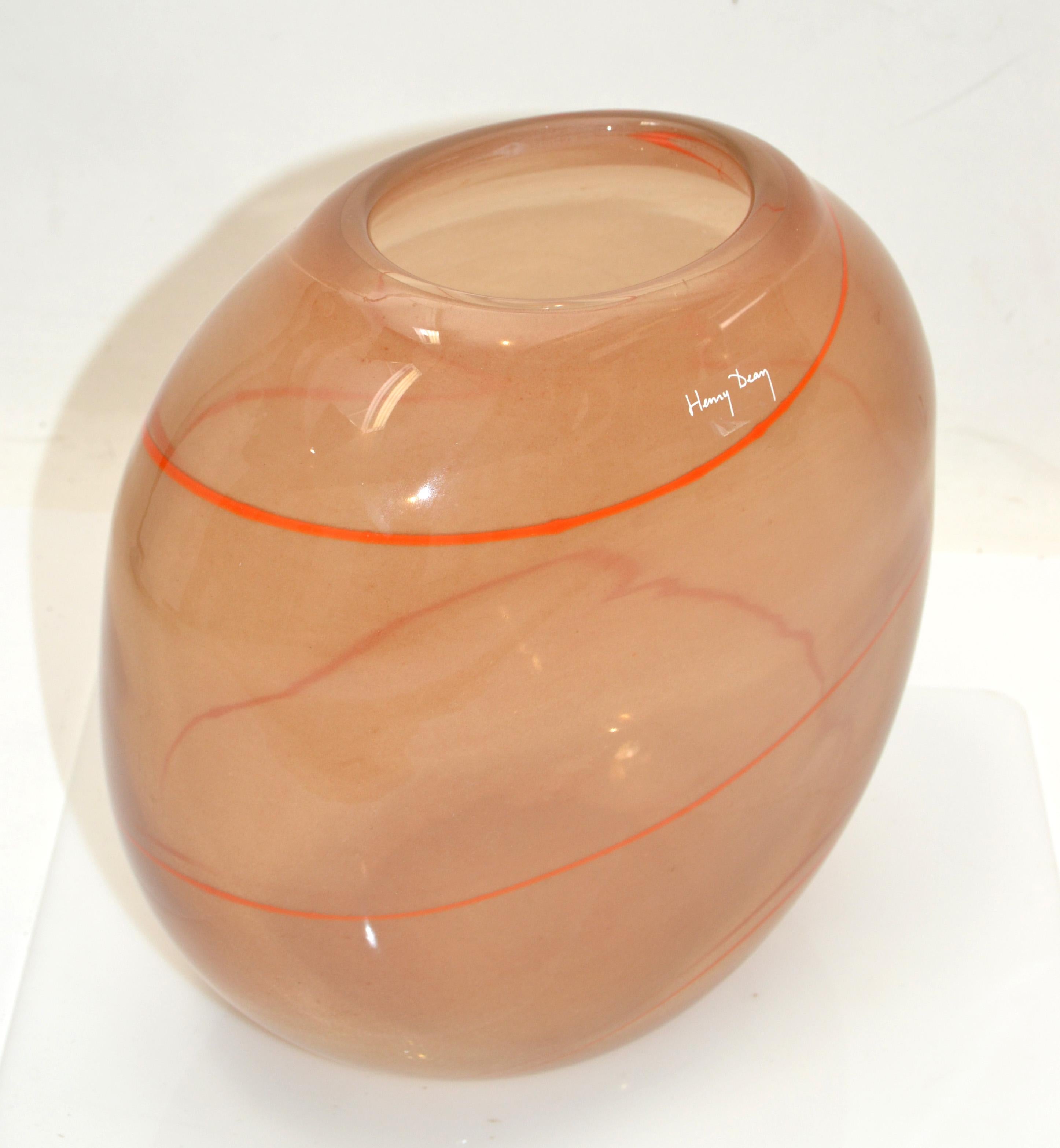 Henry Dean European Mid-Century Modern striking apricot and orange blown art glass vase or bowl from Belgium.
This piece is very heavy and looks stunning from every angle.
Marked at the opening. The Opening measures 4 x 3 inches.