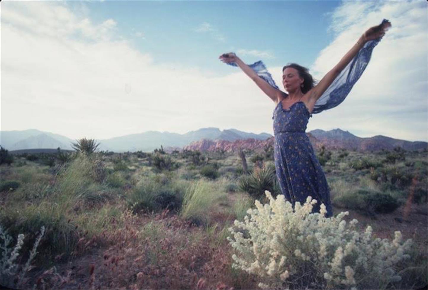 Henry Diltz Color Photograph - Joni Mitchell in Desert, 1970