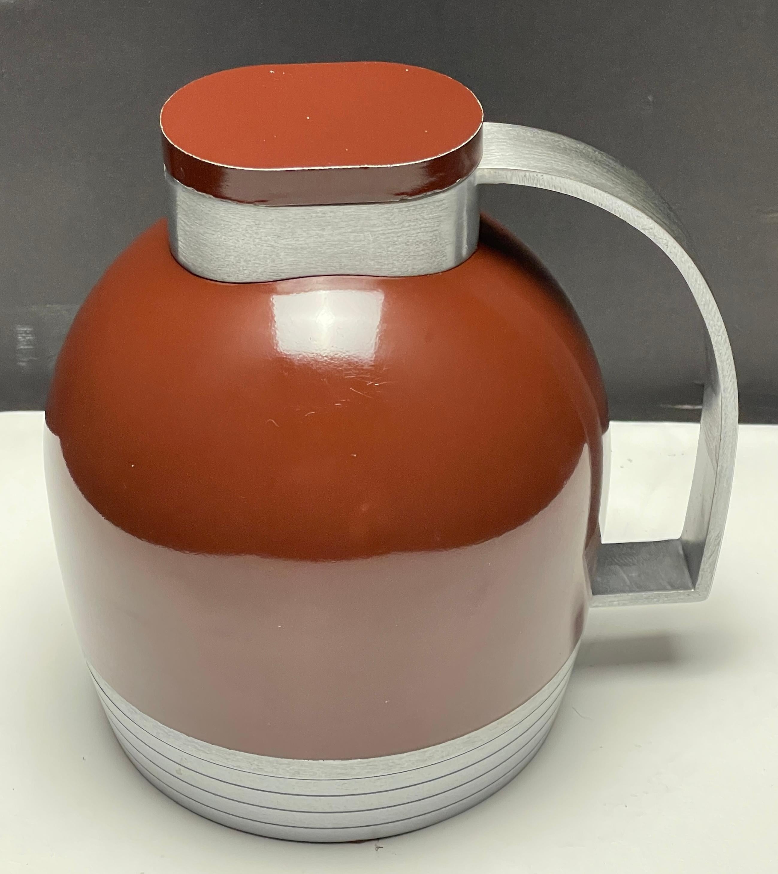 Thermos carafe designed by Henry Dreyfuss for The American Thermos Bottle Company.
Henry Dreyfuss was an American industrial designer known for his streamlined designs for telephones, vacuum cleaners, typewriters, and other household items. He also