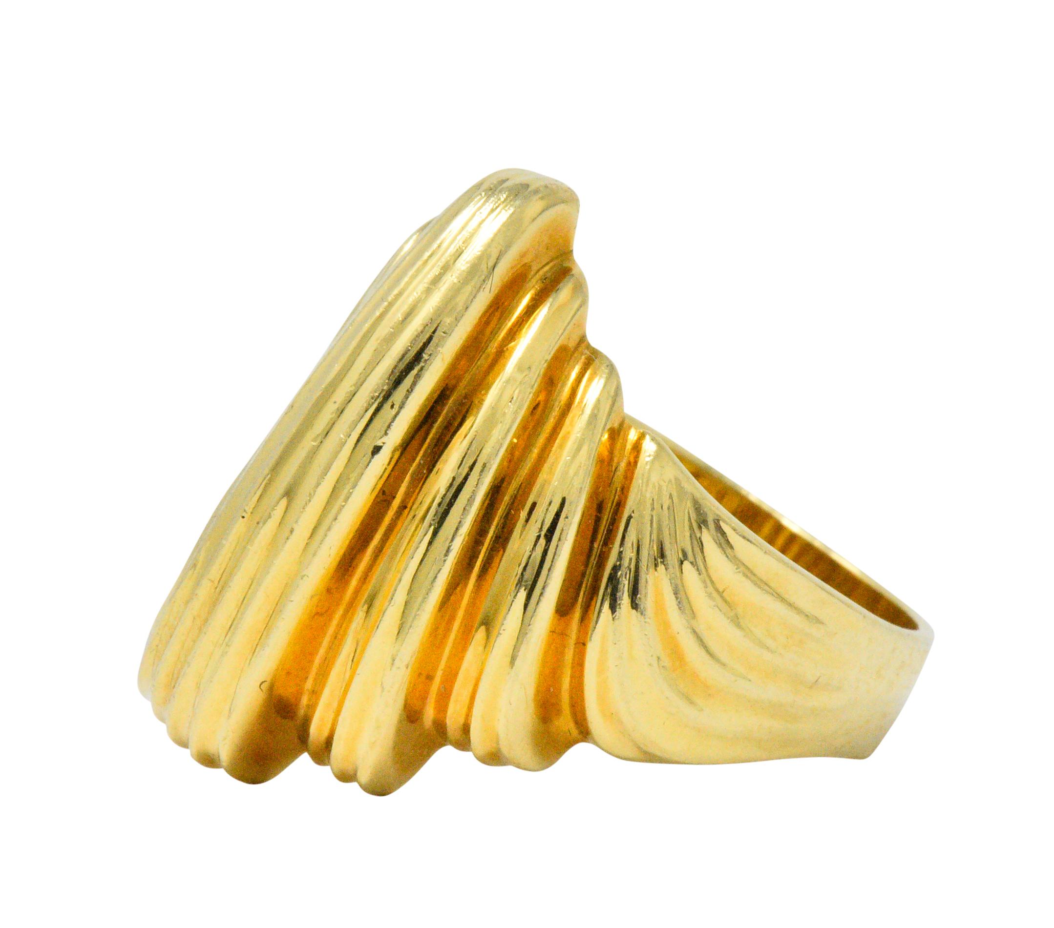 Featuring high polished gold with fluted and tiered elements

Signed Dunay, with maker's mark

Ring Size: 9 1/2 & Sizable

Top measures 22.5 mm and sits 6.0 mm high

Total Weight: 11.0 Grams

Fluid. Bold. Striking. 
 

Stock Number: We- 1535