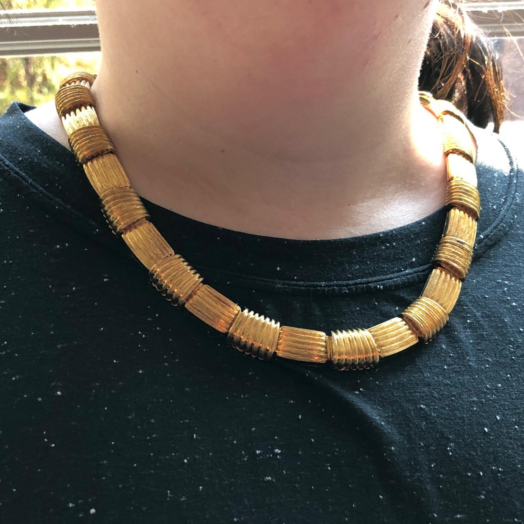 Beautifully designed and masterfully handcrafted chic and wearable 18 karat gold necklace by Henry Dunay. Alternating flexible links with horizontal and vertical textured gold bars create a wonderful three dimensional and stylish look. Signed Henry