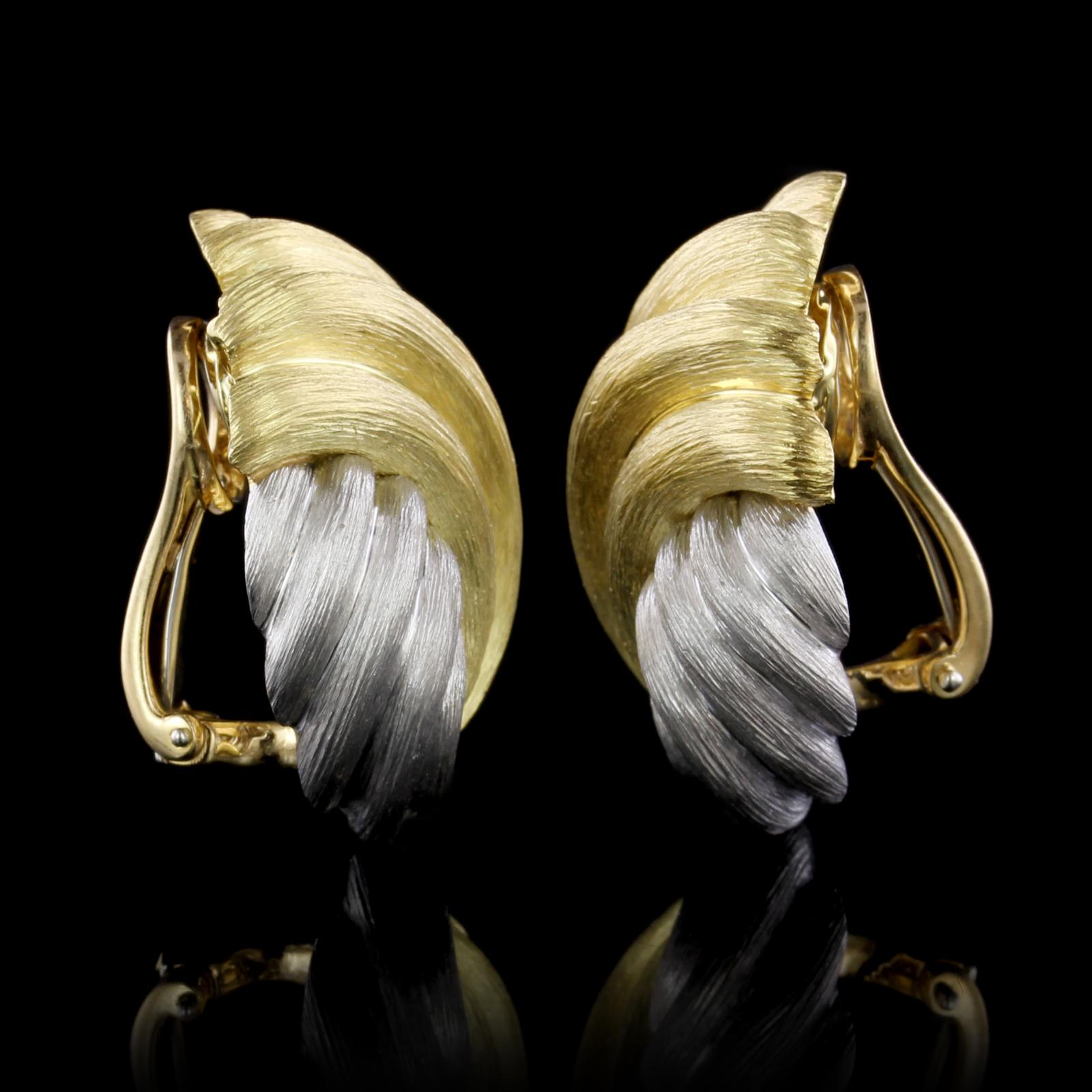 Henry Dunay 18K Yellow Gold and Platinum Clip Earrings. The earring are designed with brushed platinum and gold, width 1 1/8