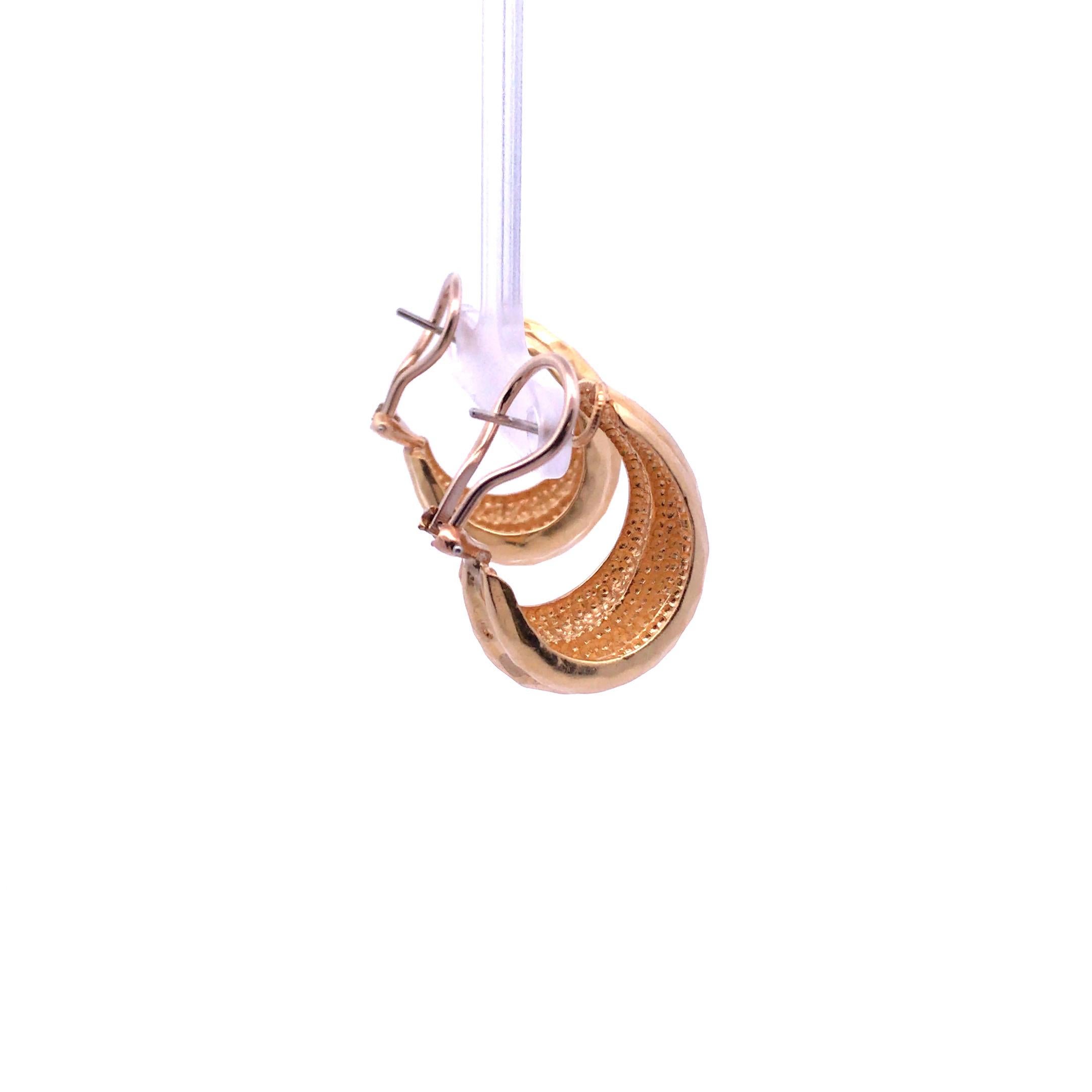 A classic pair of hammered earrings done in 18 karat yellow gold and signed by the Henry Dunay.

 Weighs 20.1 grams