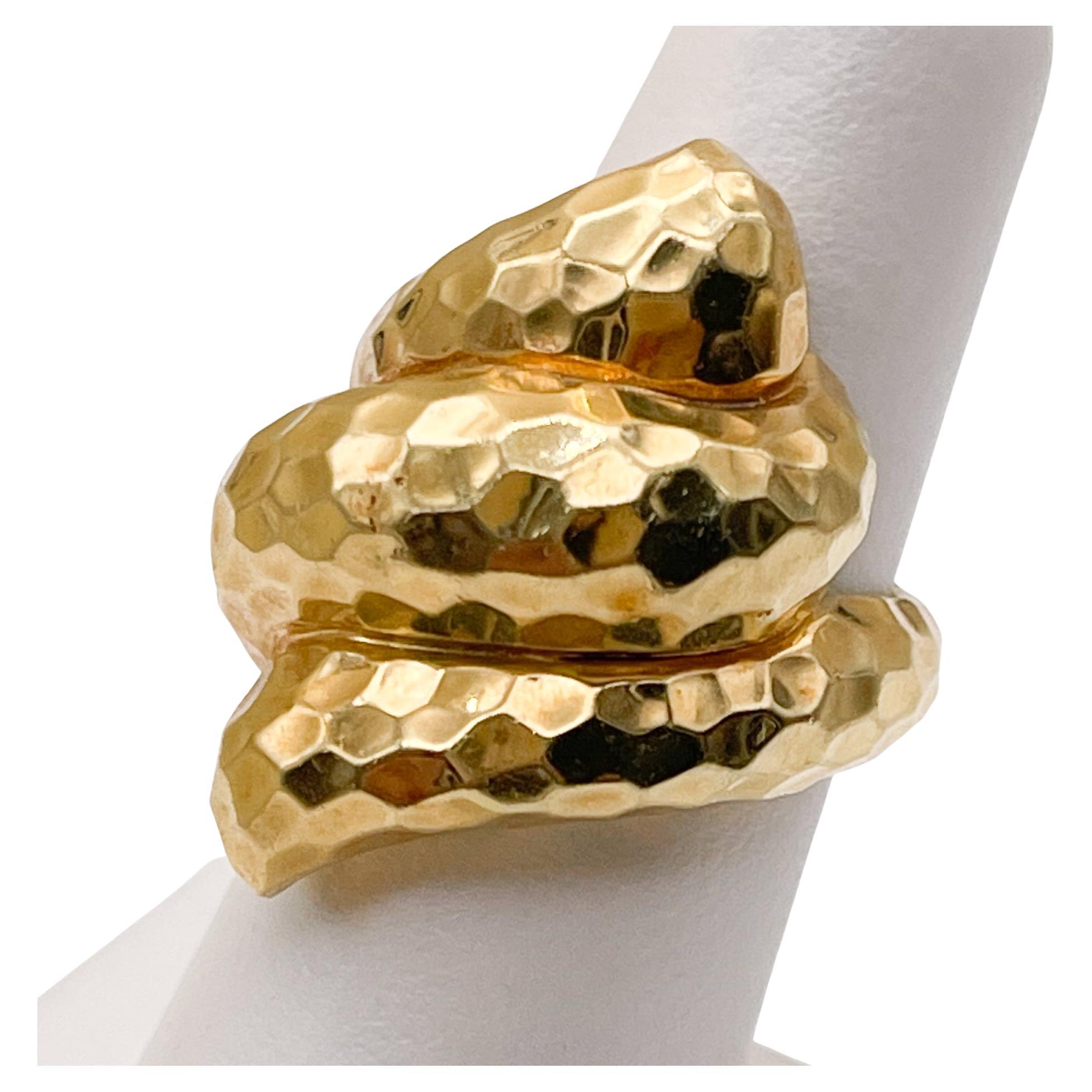 HENRY DUNAY 18K HAMMERED TWISTED RING

Now retired Henry Dunay is a world renown jewelry designer.
His vintage pieces are a great addition to anyones jewelry collection.
This ring is in great vintage condition.

18K Yellow Gold
Size: 6.5

Marks: