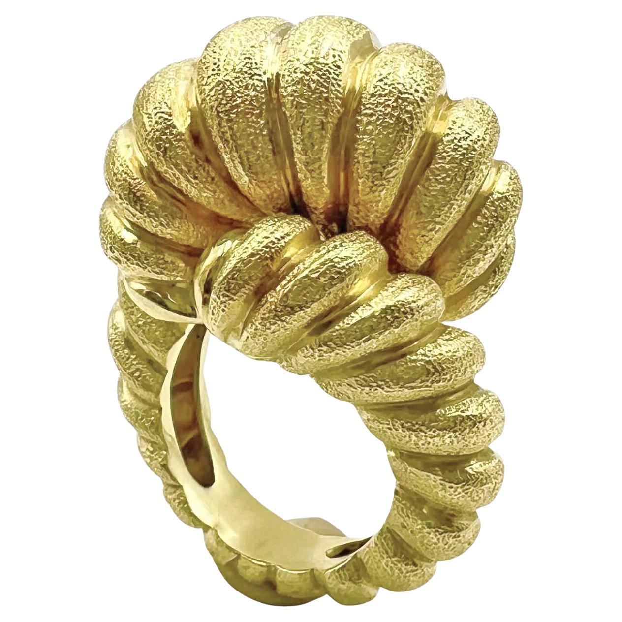 Bold rope-twist motif knot ring in 18k yellow gold by Henry Dunay.  The stylized knot measures 22.7mm on top graduating to 6.4mm at the base.  Signed '© Dunay ® 18K'.  Size 8.5 (resizable to most ring sizes).

Henry Dunay was an American goldsmith