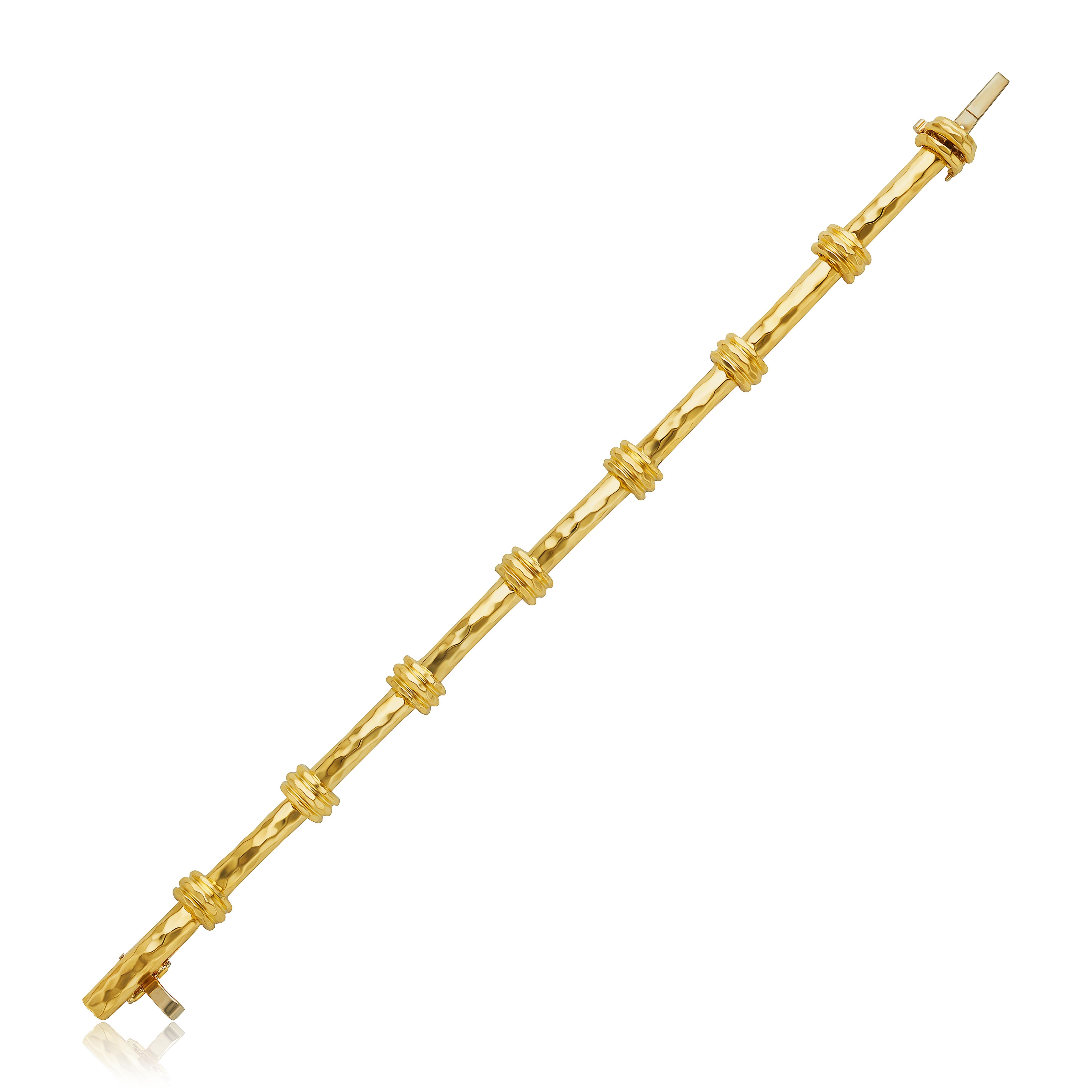 From the Eiseman Estate Jewelry Collection, this 18k yellow gold Henry Dunay bracelet has a bamboo design and measures at 7” long. 