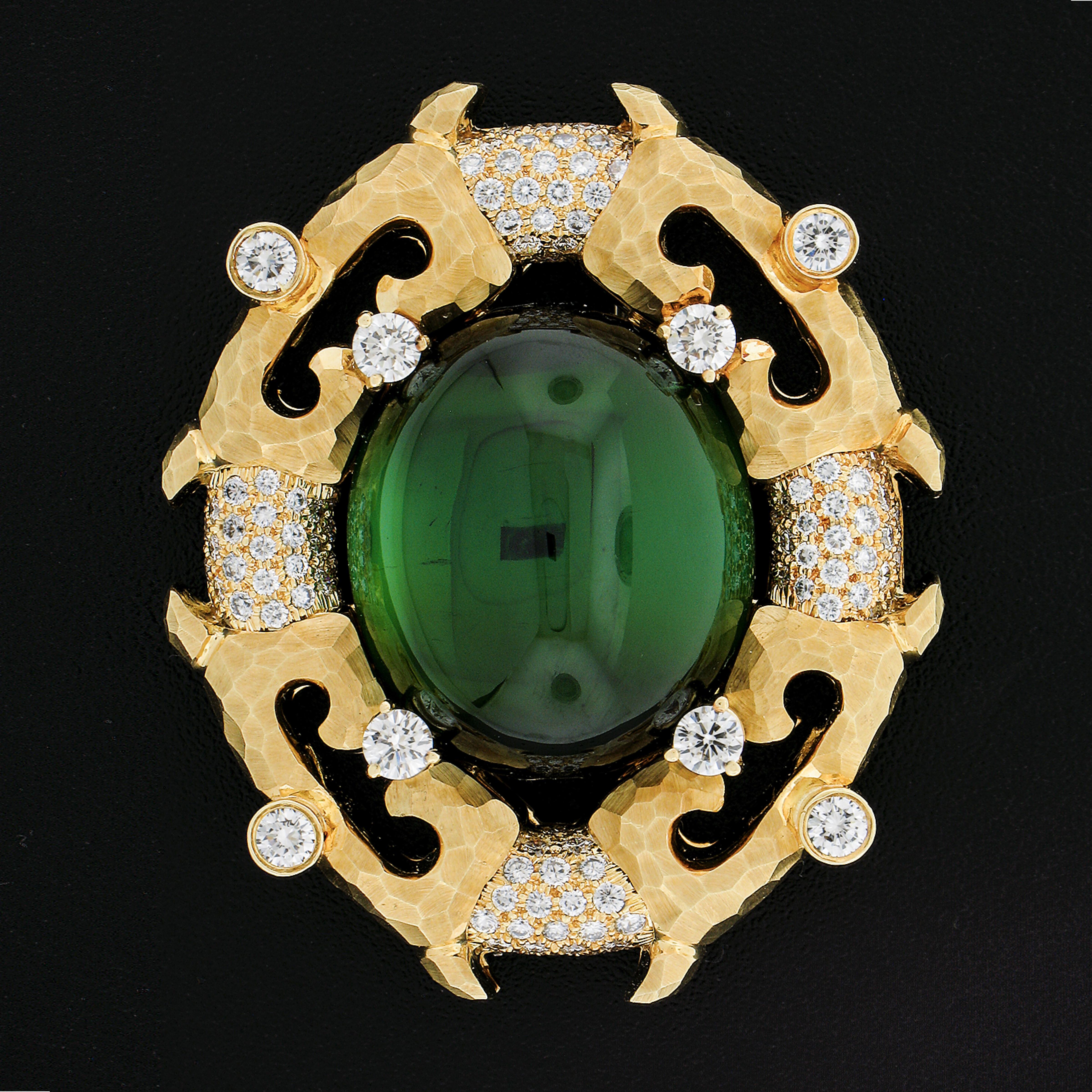 Henry Dunay is known for quality gemstones, diamonds and Gold finishing. All that is on full display with this magnificent work of Art. The center Green Tourmaline is clean and vivid in color. It is accented by various colorless ideal diamonds.