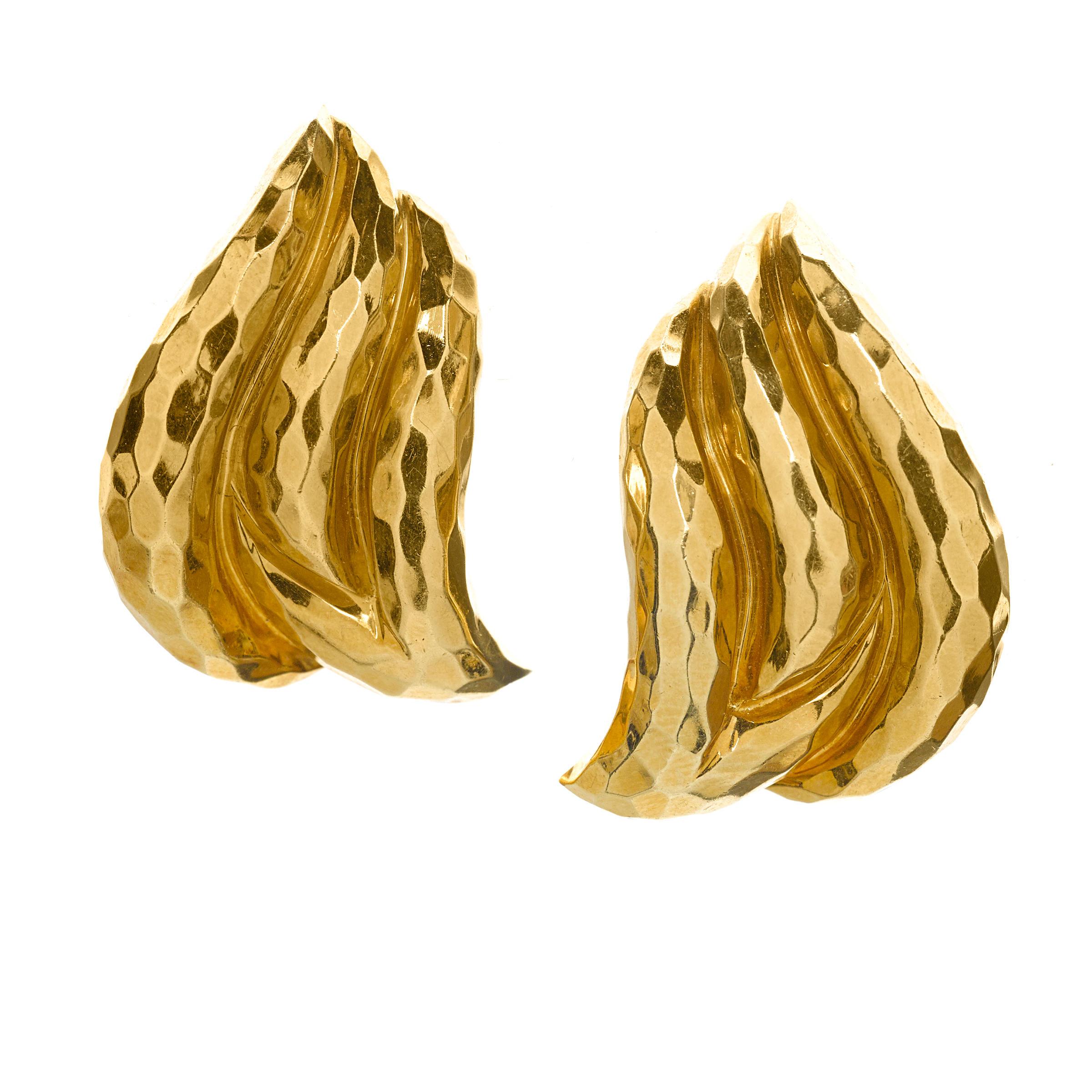 Gorgeous hammered 18k gold earrings by Henry Dunay.
Features collapsible posts. (Can be worn on pierced or unpierced ears.)
Pieces are in good condition. Show few signs of aging or wear.
Featured in Bonhams 