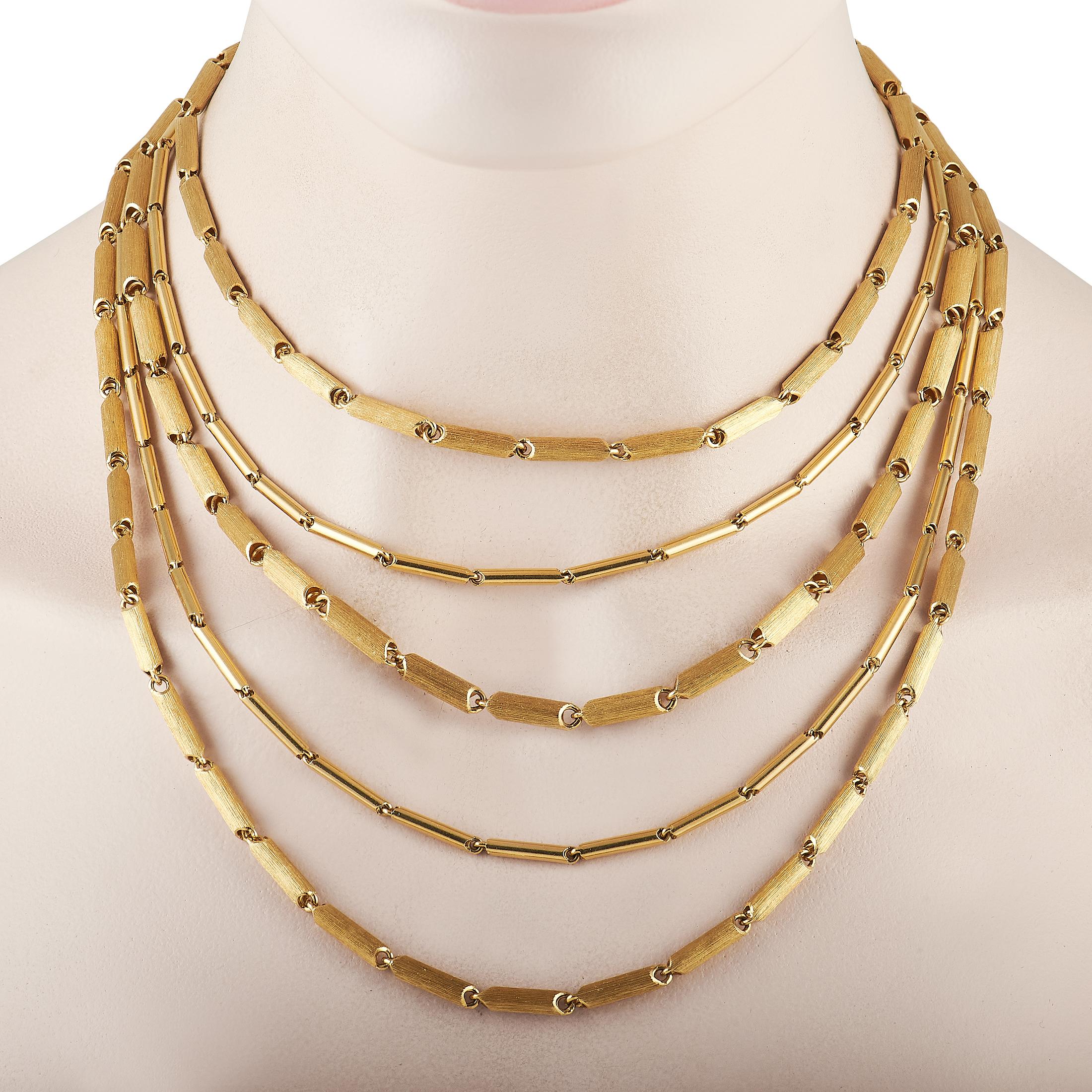 A series of 18K Yellow Gold links on five individual strands come together to create this bold, sophisticated Henry Dunay necklace. This striking accessory measures 15” long and comes complete with secure clasp closure. 