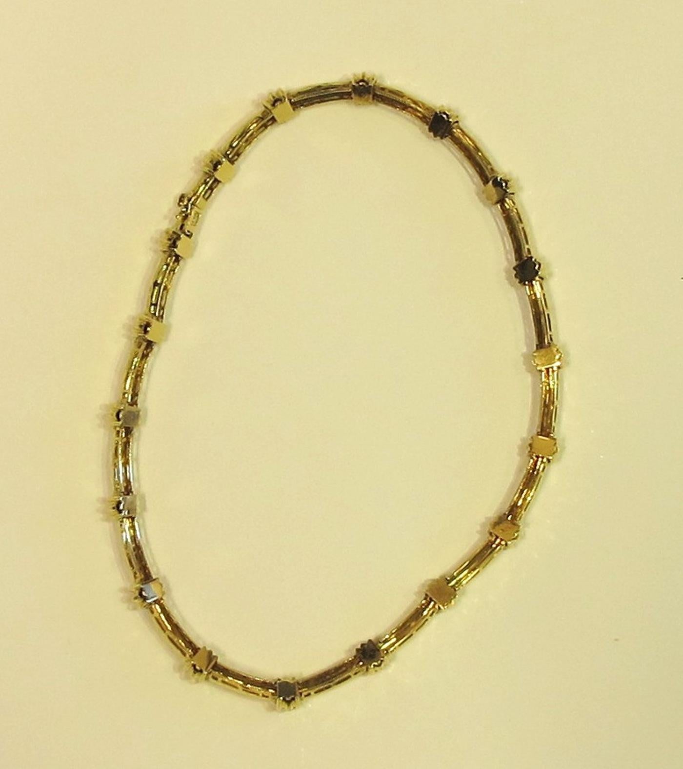 Signed by Henry Dunay.  18 Karat yellow gold notched necklace. 68 grams in weight.  15 inches in length.