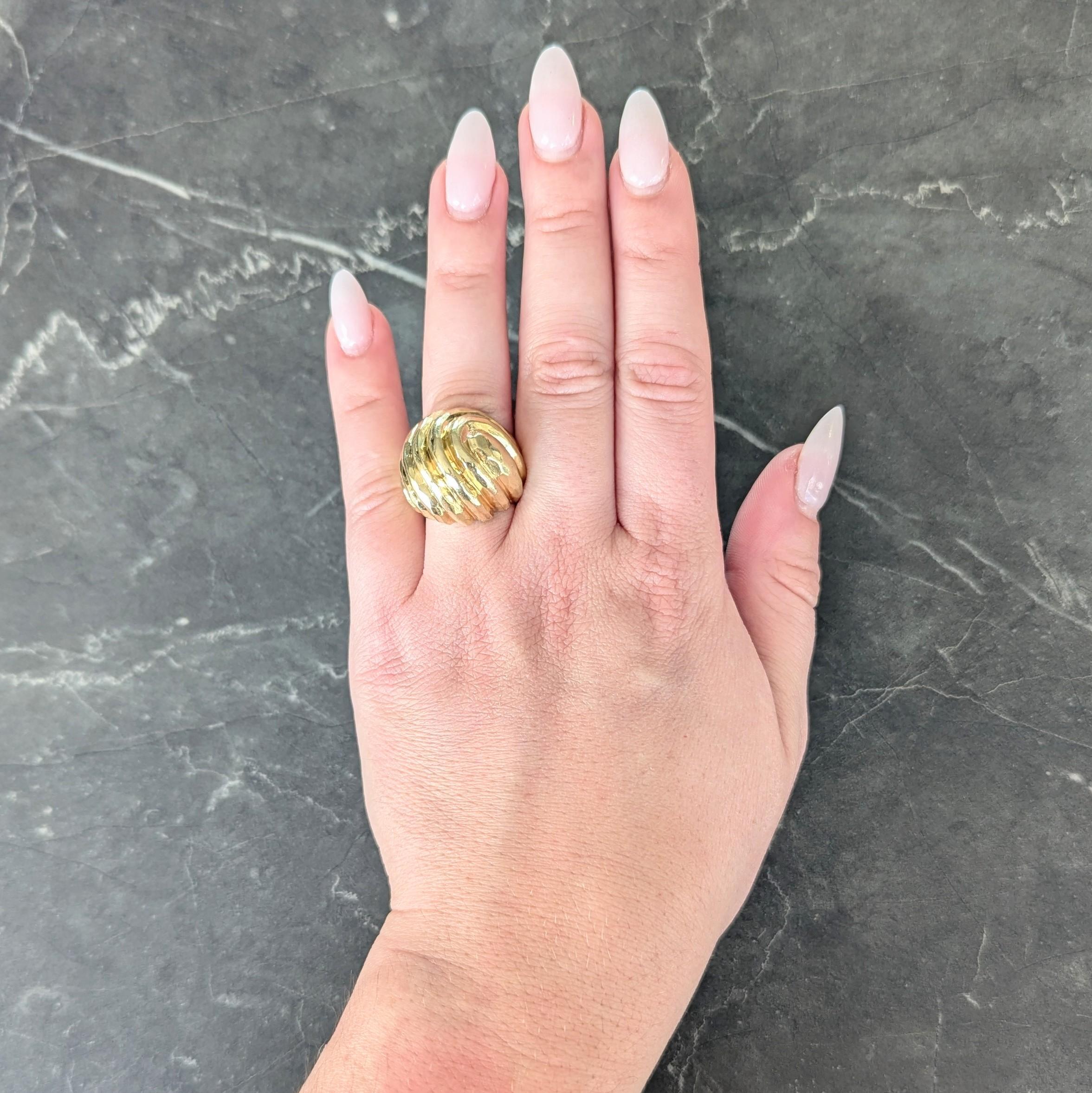 Designed as a domed form with deeply ridged segments and swirl motif
Featuring a hammered texture throughout
Completed by high polish finish
Stamped for 18 karat gold
Fully signed for Dunay
Circa: 1970s
Ring Size: 5 3/4 and sizable
Measures north to