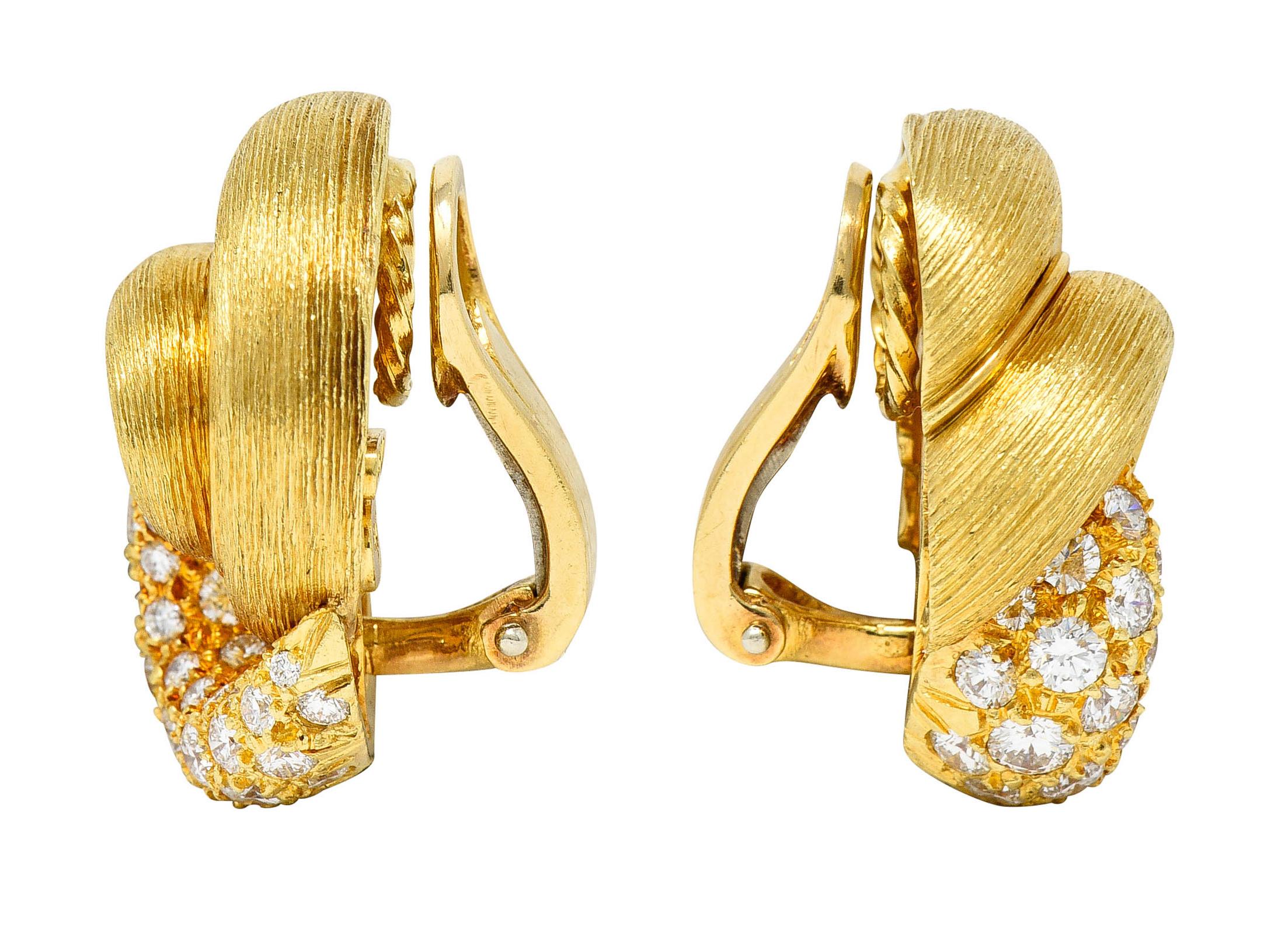 Ear-clips are depicted as twisting knots with a deeply ridged texture

Pavè set with round brilliant cut diamonds

Weighing in total approximately 2.00 carats with G/H color and VS in clarity

Completed by hinged omega backs

Stamped 18K for 18