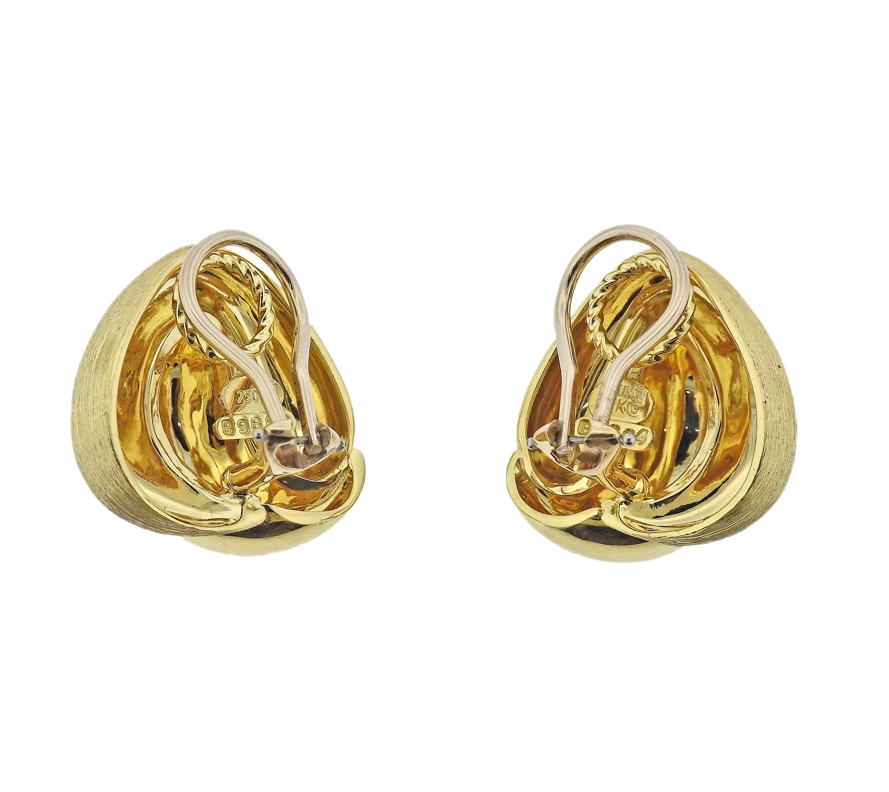 Pair of 18k signature brushed and high polish gold earrings by Henry Dunay. Earrings are 23mm x 22mm. Marked: 69884, 18k, Dunay. Weight - 26.5 grams.