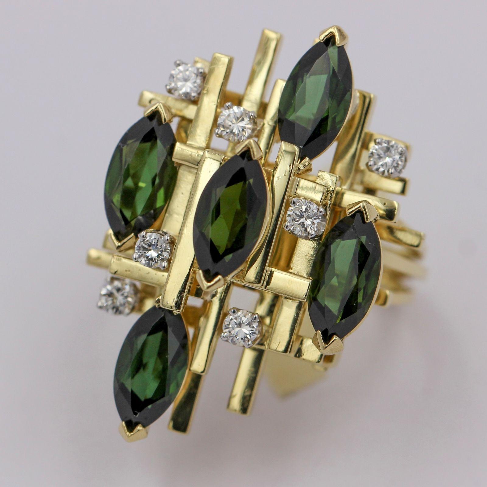 Henry Dunay green tourmaline and diamond ring crafted in 18 karat gold. Size 10. Circa 1970s. The ring is prong set with 5 marquise-cut chrome tourmalines and 7 round-cut natural diamonds. Estimated total carat weight of diamonds, .50ct.