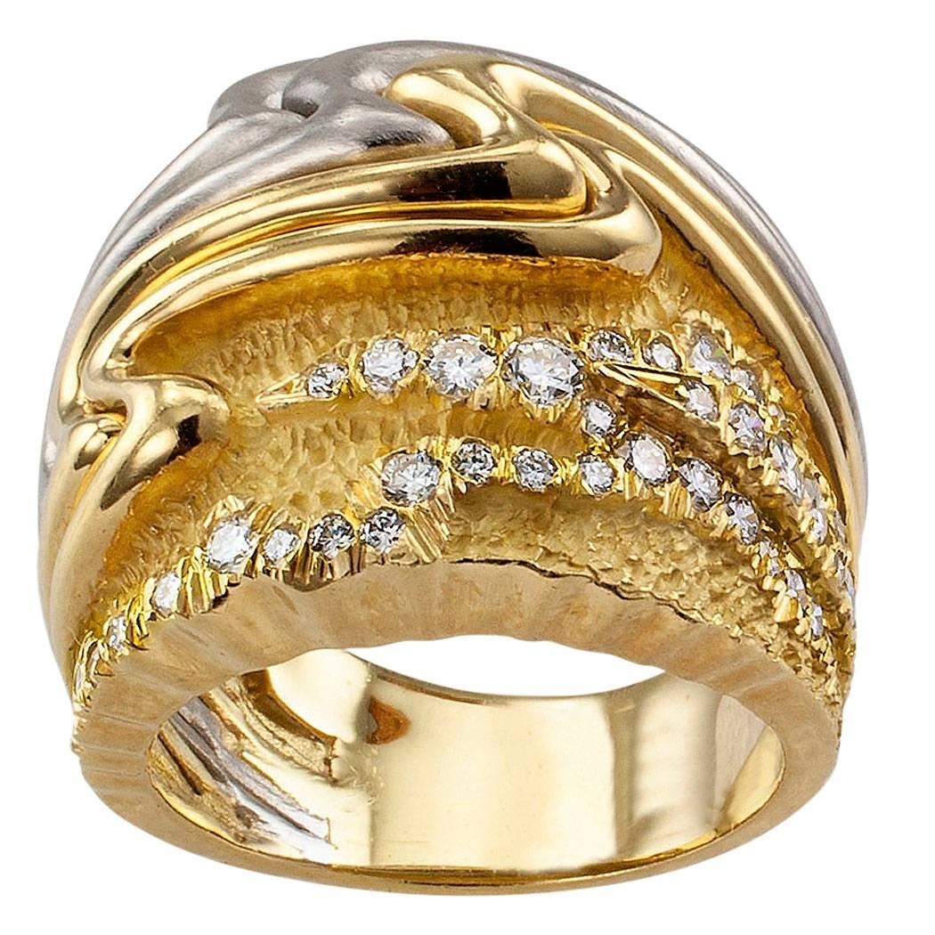 Henry Dunay diamond gold and platinum ring band circa 2000. The design is full to capacity with an abundance of color, patterns and textures tingled by the sparkle of forty-two, carefully arranged round brilliant-cut diamonds totaling approximately