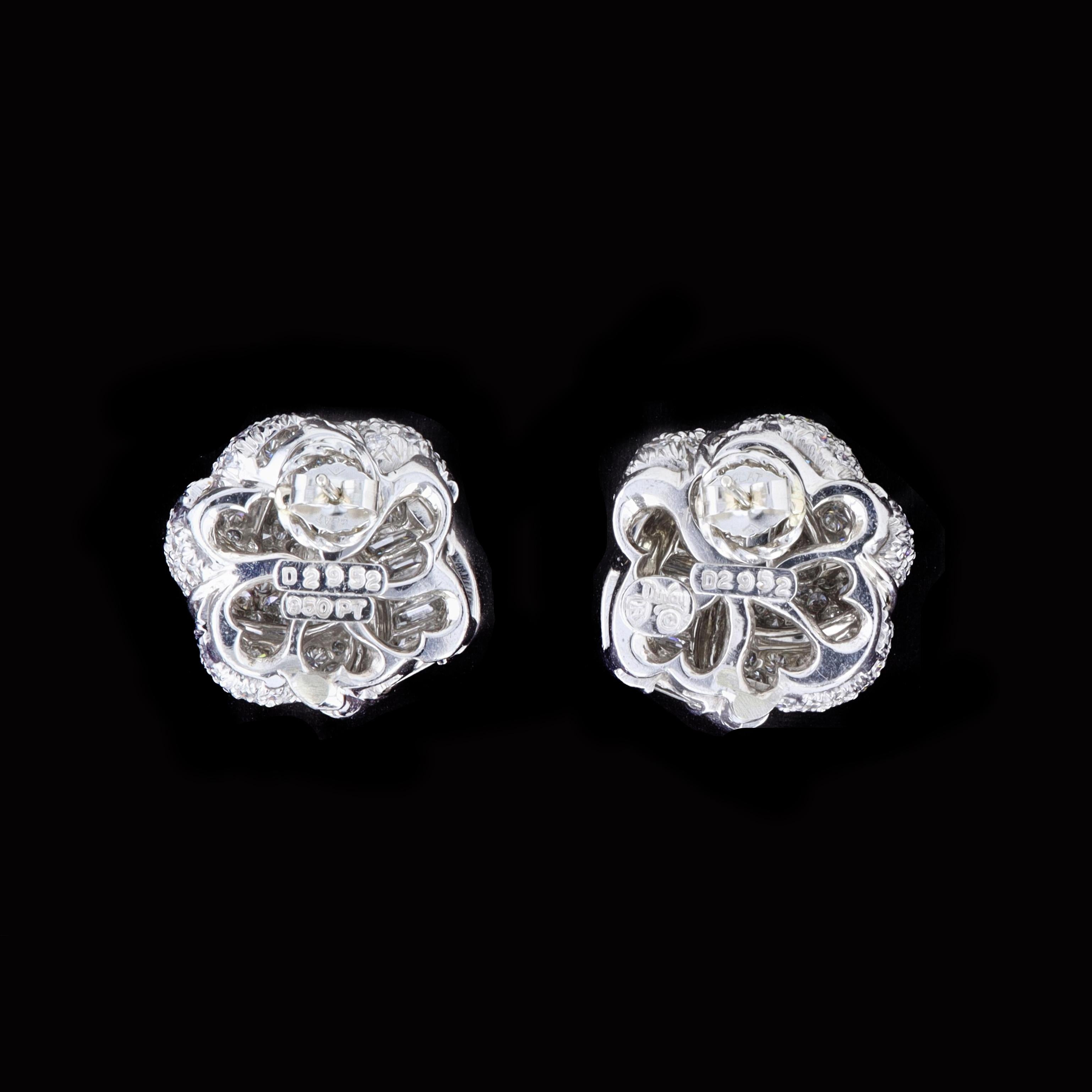 Created by acclaimed jewelry designer Henry Dunay, these 2.95ct diamond platinum earrings feature an intricate design and unending shimmer. The earrings feature baguette and round cut diamonds that weigh approximately 2.95ct. The color of these