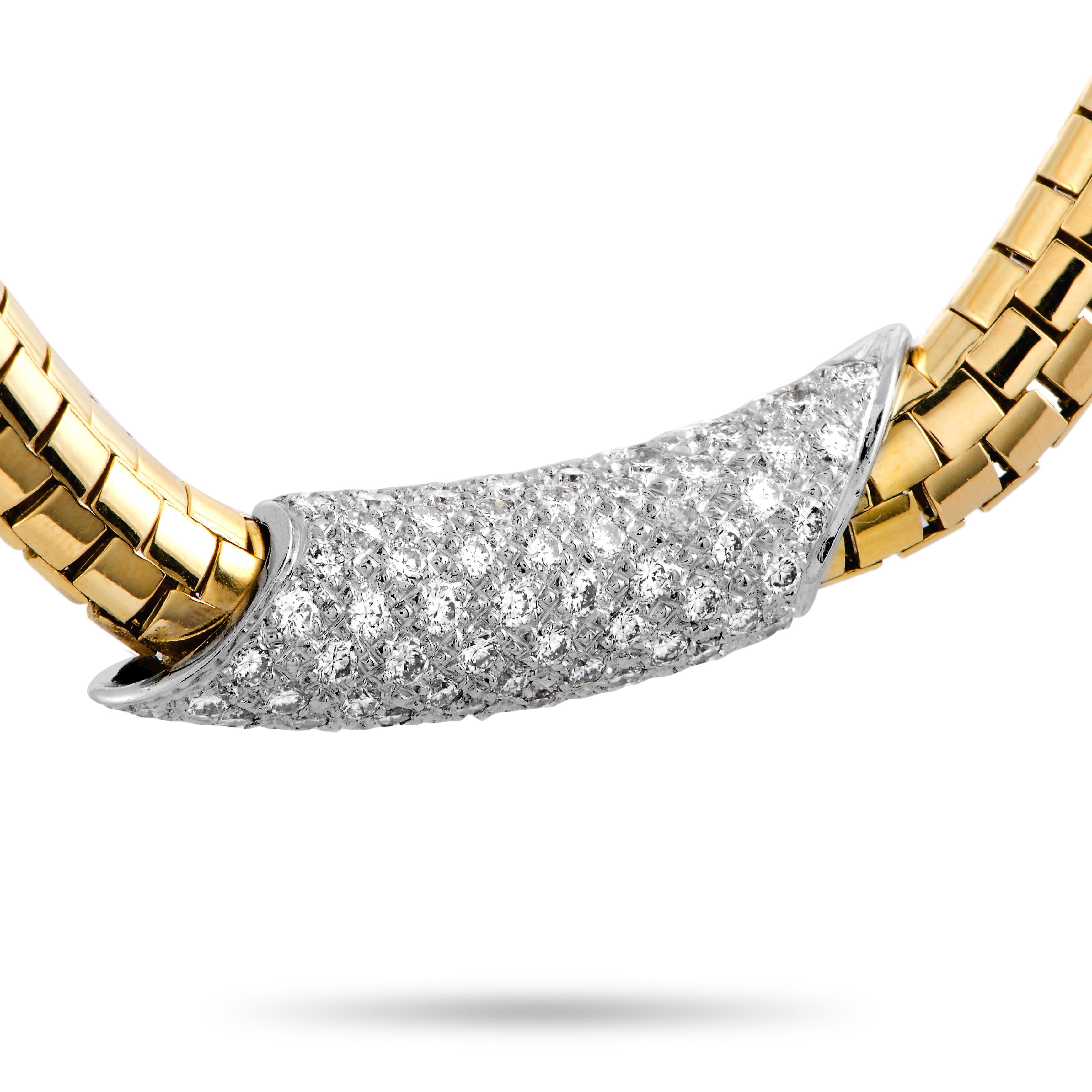 This Henry Dunay necklace is made of 18K yellow gold and platinum and weighs 75 grams, measuring 15” in length. The necklace is set with diamonds that boast grade F color and VS1 clarity and amount to 2.75 carats.

Offered in estate condition, this