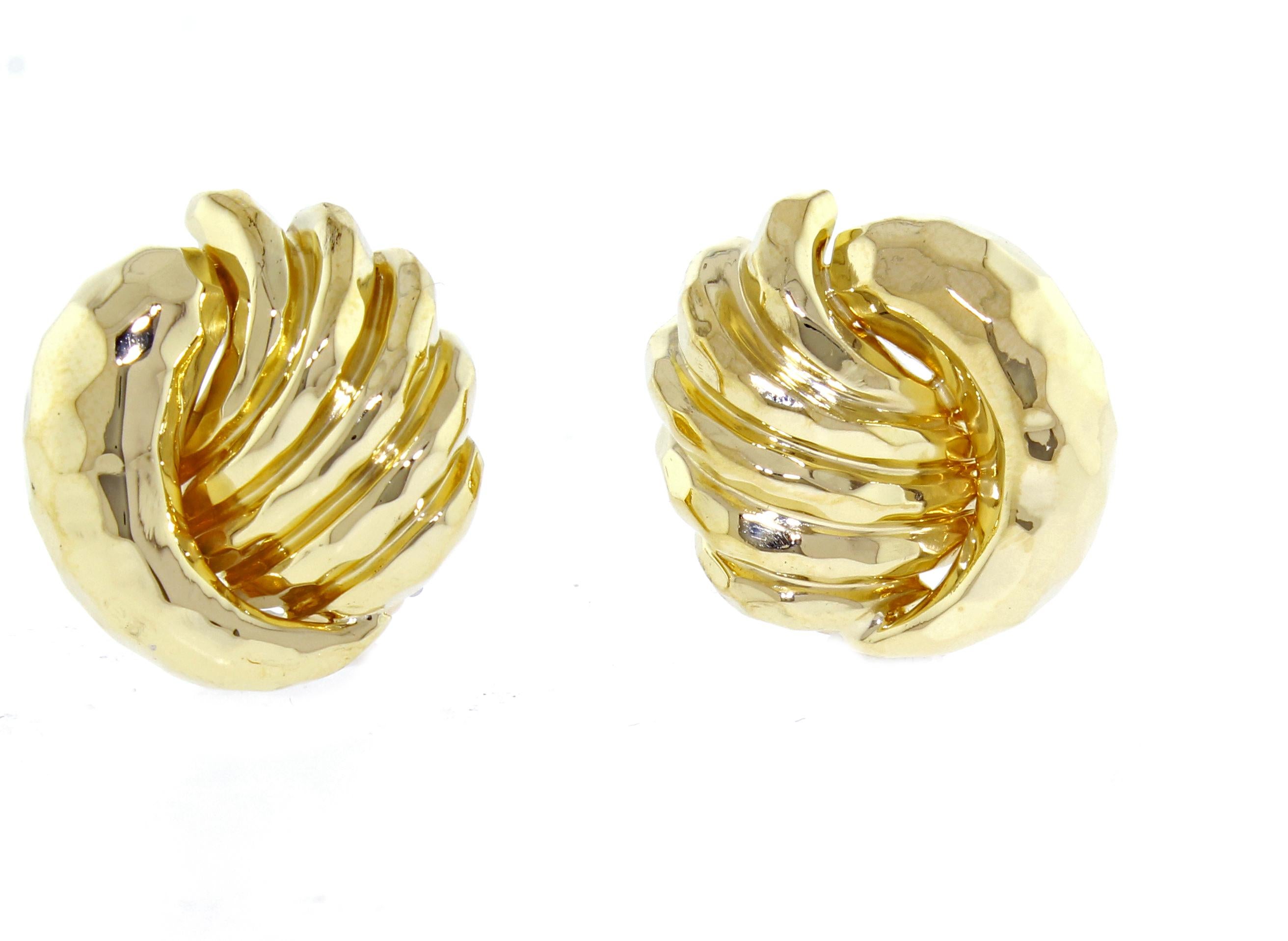 From award winning designer Henry Dunay, a a pair of 18 karat gold earrings. The earring feature Dunay's signature hammerers finish. 23 grams  22mm X 21mm clip backs, post maybe added id desires