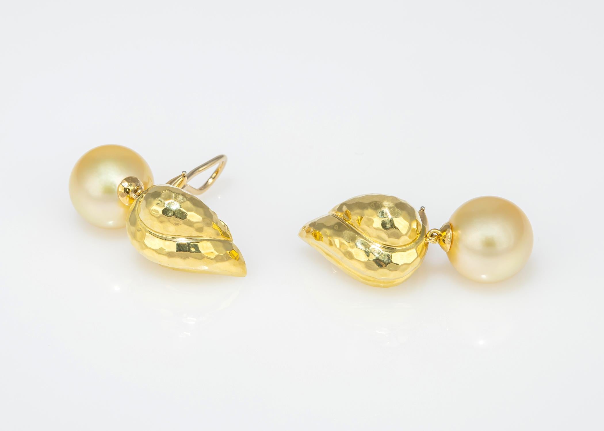 Henry Dunay is one of the greatest American jewelers of our time. This pair of earrings, just over 1 1/2 inches in length is from his faceted collection and features 14.4mm golden South Sea pearls. Chic and wearable. An alternative to an ordinary