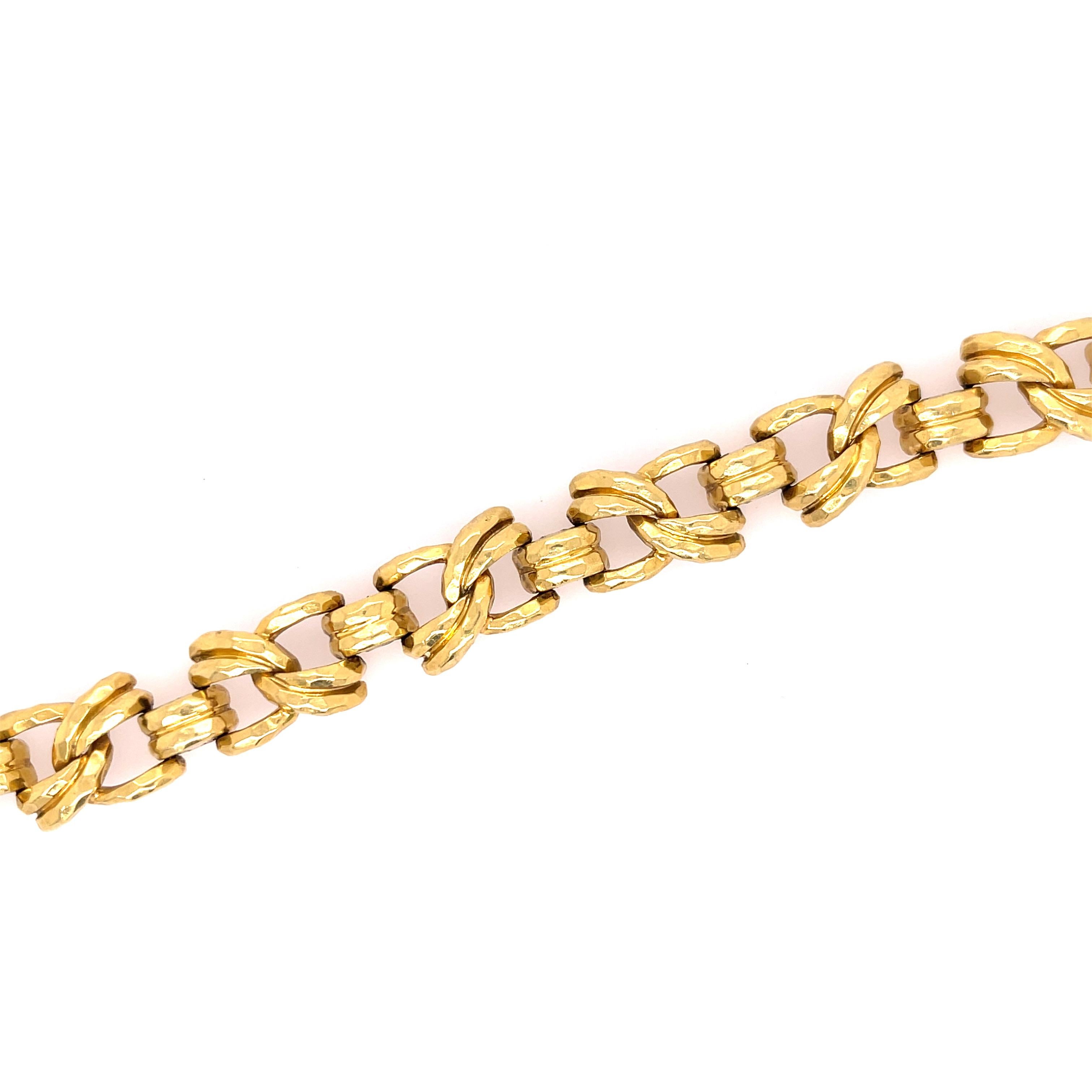 Henry Dunay Faceted Link Bracelet in 18K Yellow Gold. The bracelet is 7.5 inches in length and 11.30mm in width. 