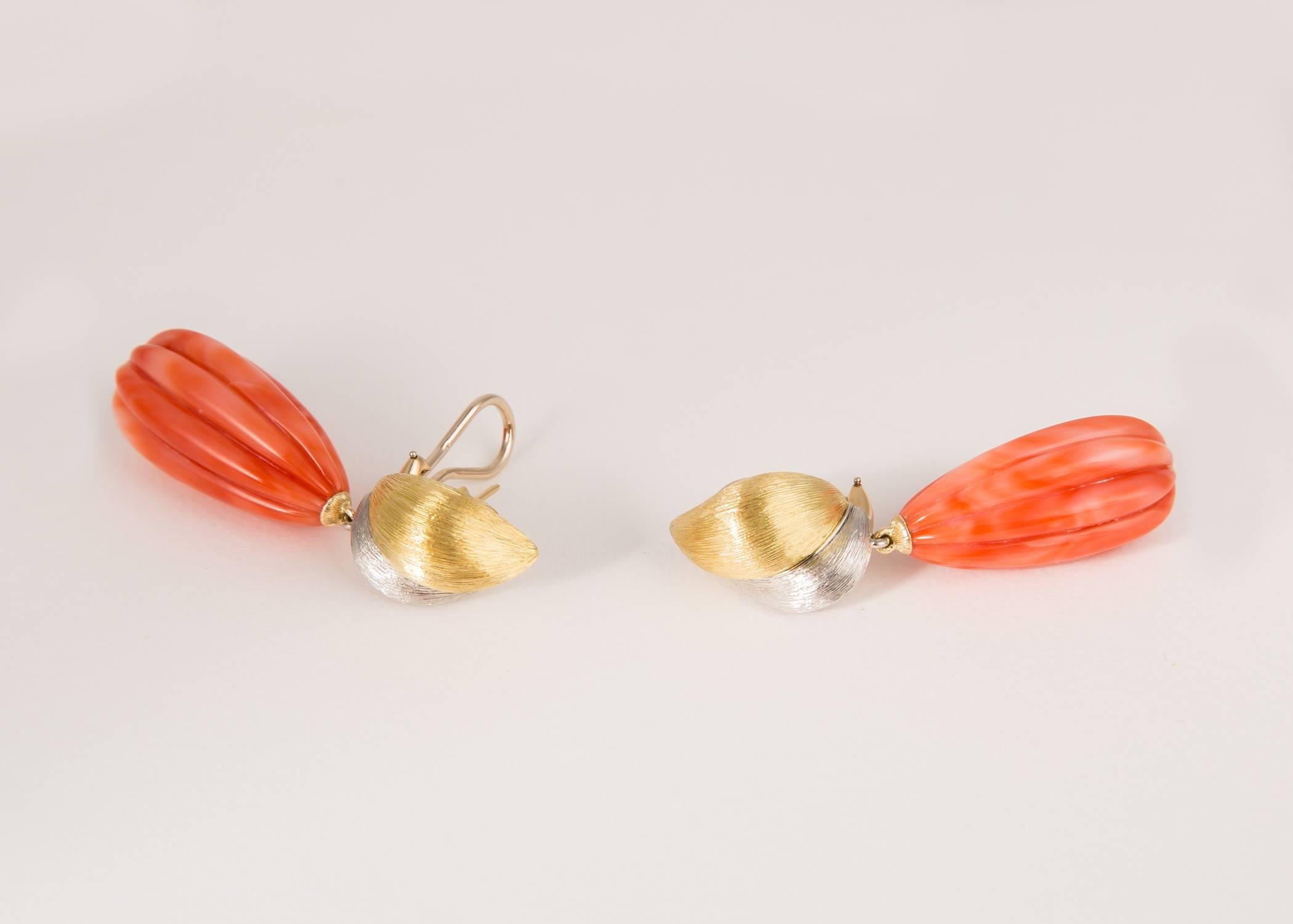 Simply spectacular. Henry Dunay combines rich 18k gold and platinum and elegant carved coral.  2 1/8 inches in length. 