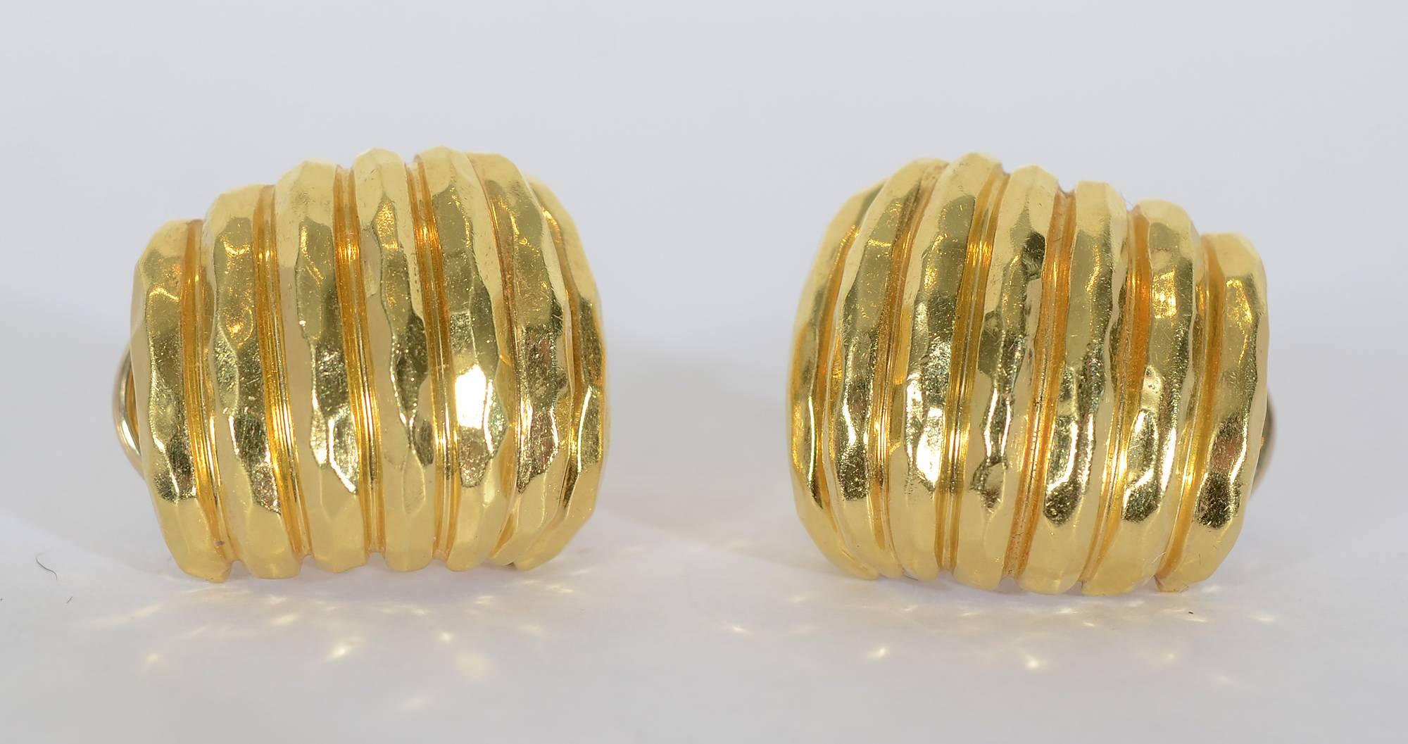 Henry Dunay hammered gold and ribbed earrings. They are half hoops as shown in thumbnail photos. Backs are posts and clips. They are 13/16