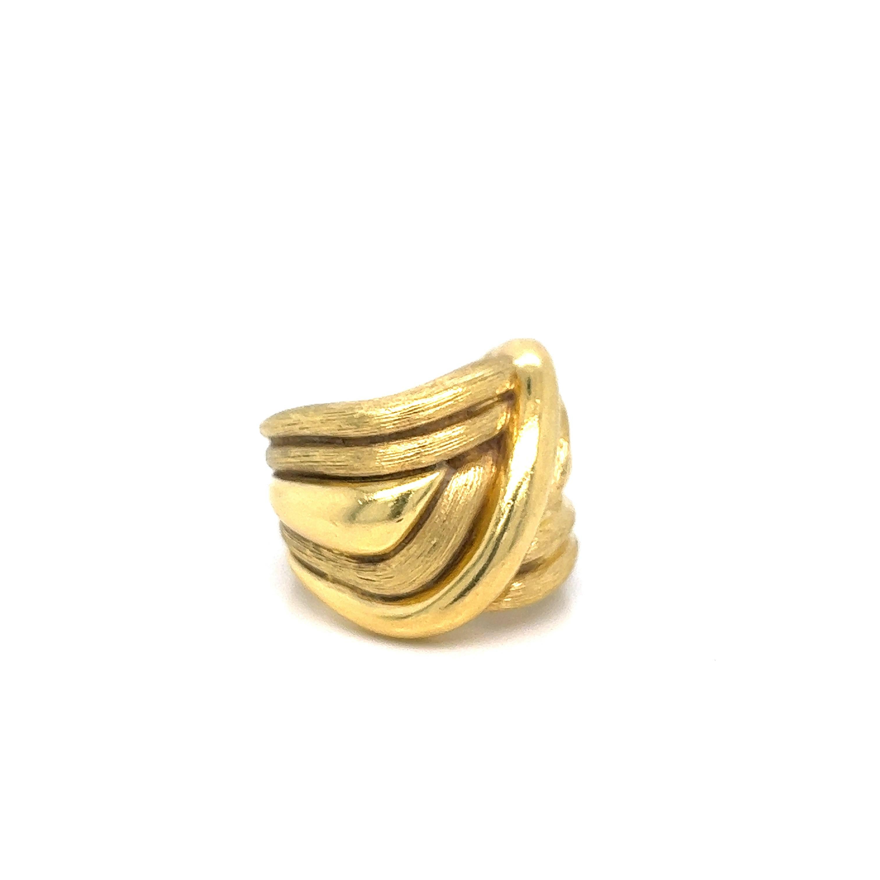 Henry Dunay 18 karat yellow gold ring. Serial no. B1125. Marked: Dunay / 18K / 750 / B1125. Total weight: 24.6 grams. Size 6. Thickest band width: 1.8 cm. 