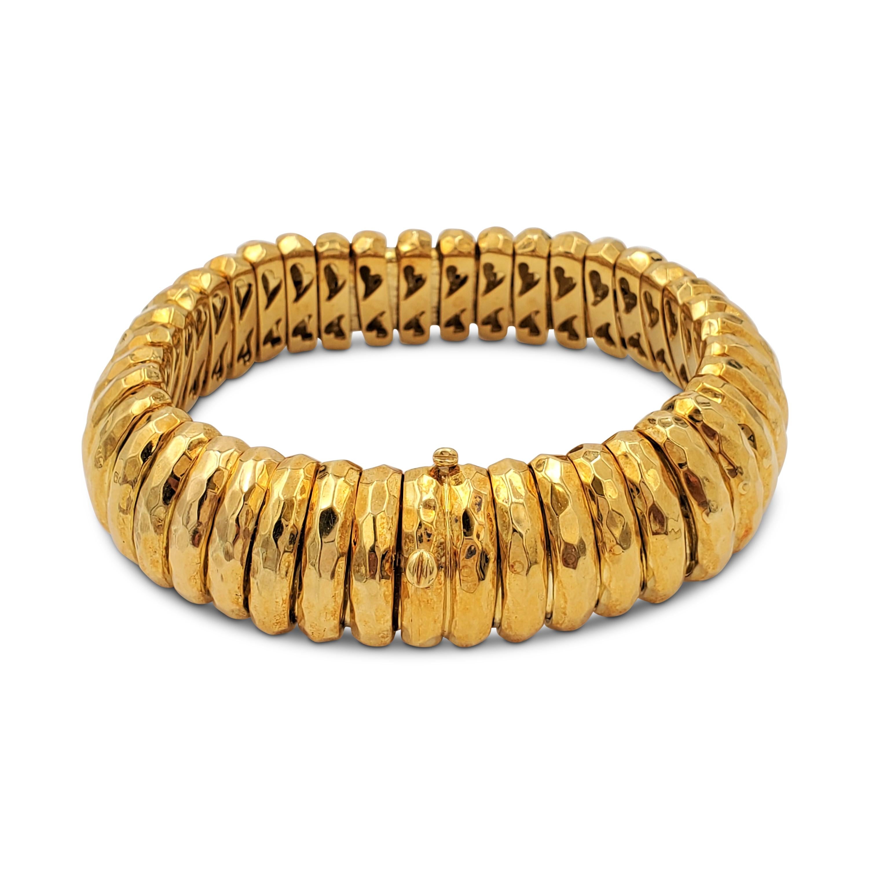 Authentic Henry Dunay bracelet crafted in 18 karat hammered gold.  Bracelet measures 8 3/4 inches in length and 3/4 inch in width with a box clasp. The flexible gold links are in excellent vintage condition and maintain their original patina. Signed