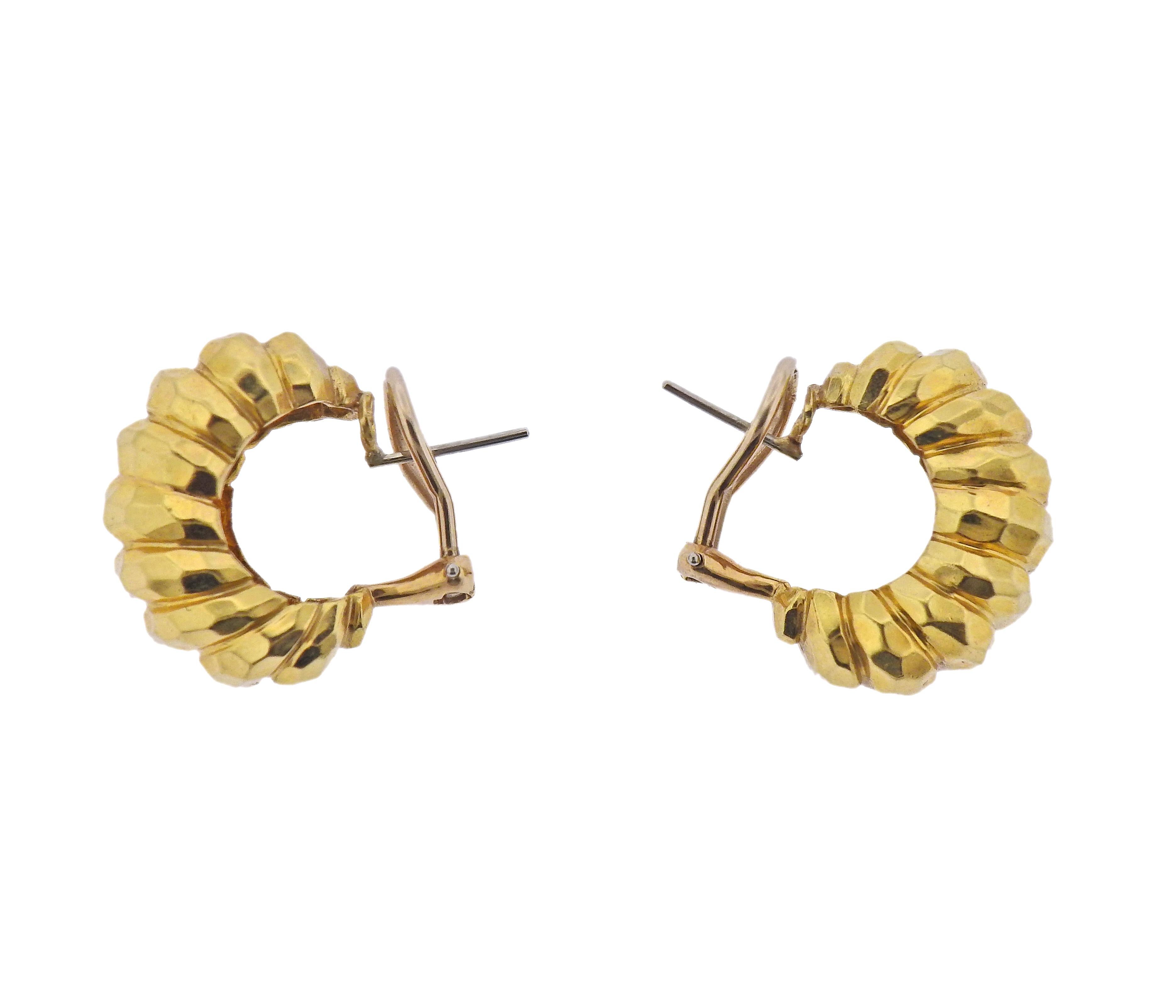 Pair of 18k yellow hammered finish gold earrings by Henry Dunay. Earrings are 23mm x 11mm. Marked: 18K, Dunay. Weight - 14.9 grams.