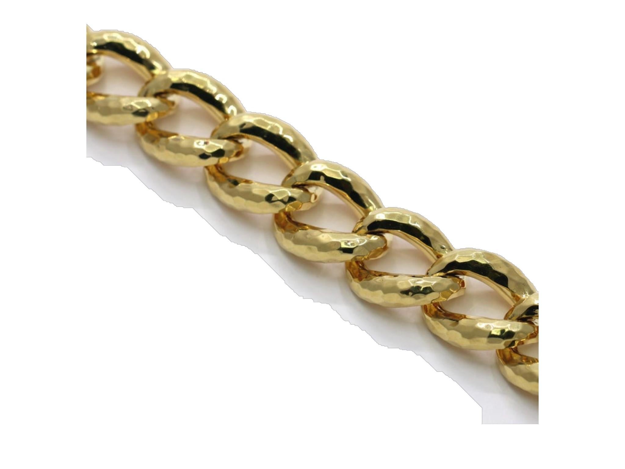 A large, 18K Yellow Gold link necklace comprised of 27 iconic hammered links, 7/8 of an inch wide by 20 inches long. Each link is beautifully polished on both sides, and crafted in a manner to provide a comfortable level of flexibility, while laying