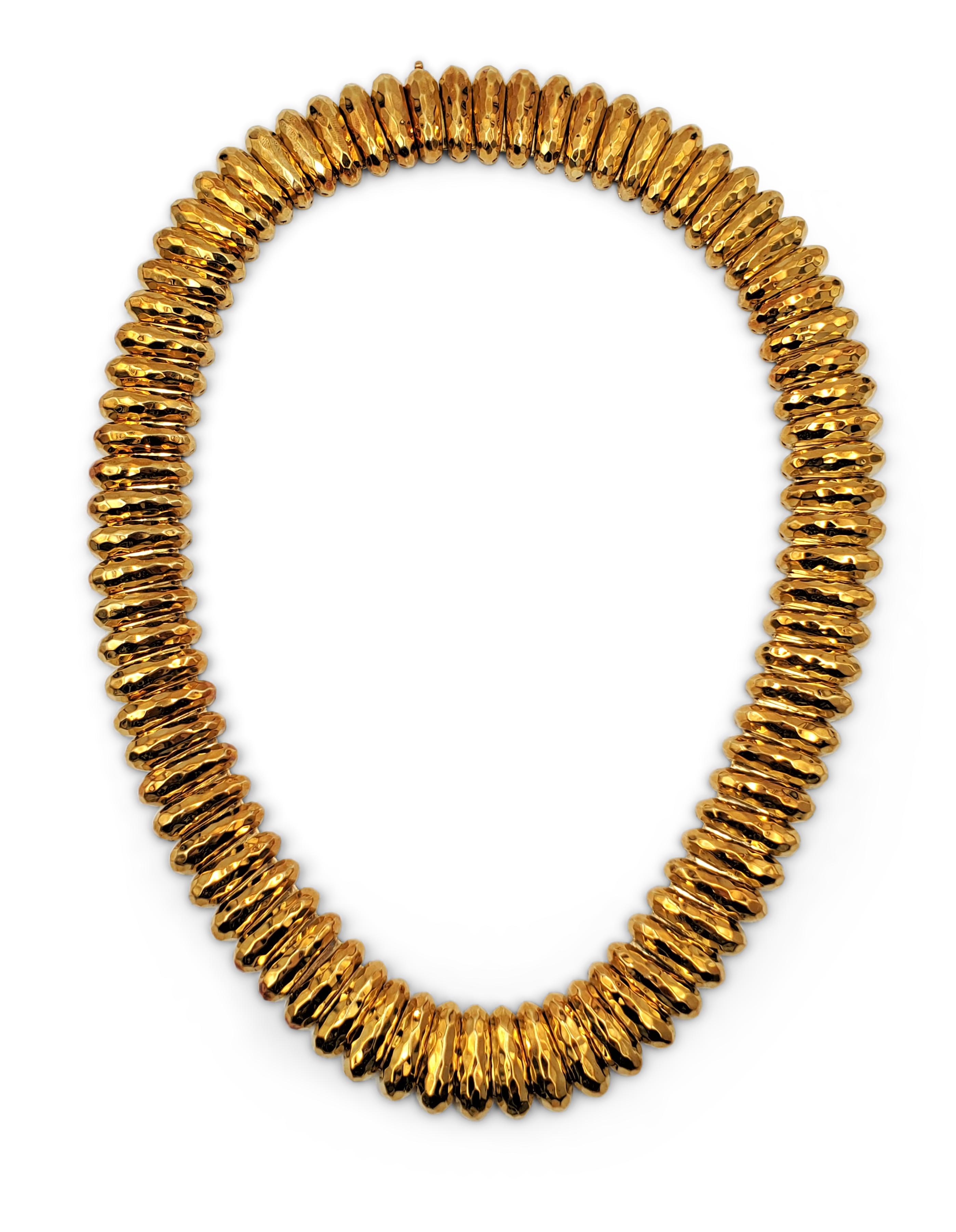 Authentic Henry Duany necklace crafted in 18 karat hammered gold.  Necklace measures 19 1/2 inches in length and 3/4 inch in width with a slide clasp.  The flexible links are in excellent vintage condition and maintain their original vintage patina.