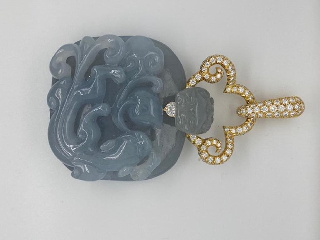 This Henry Dunay translucent gray jade pendant features a 