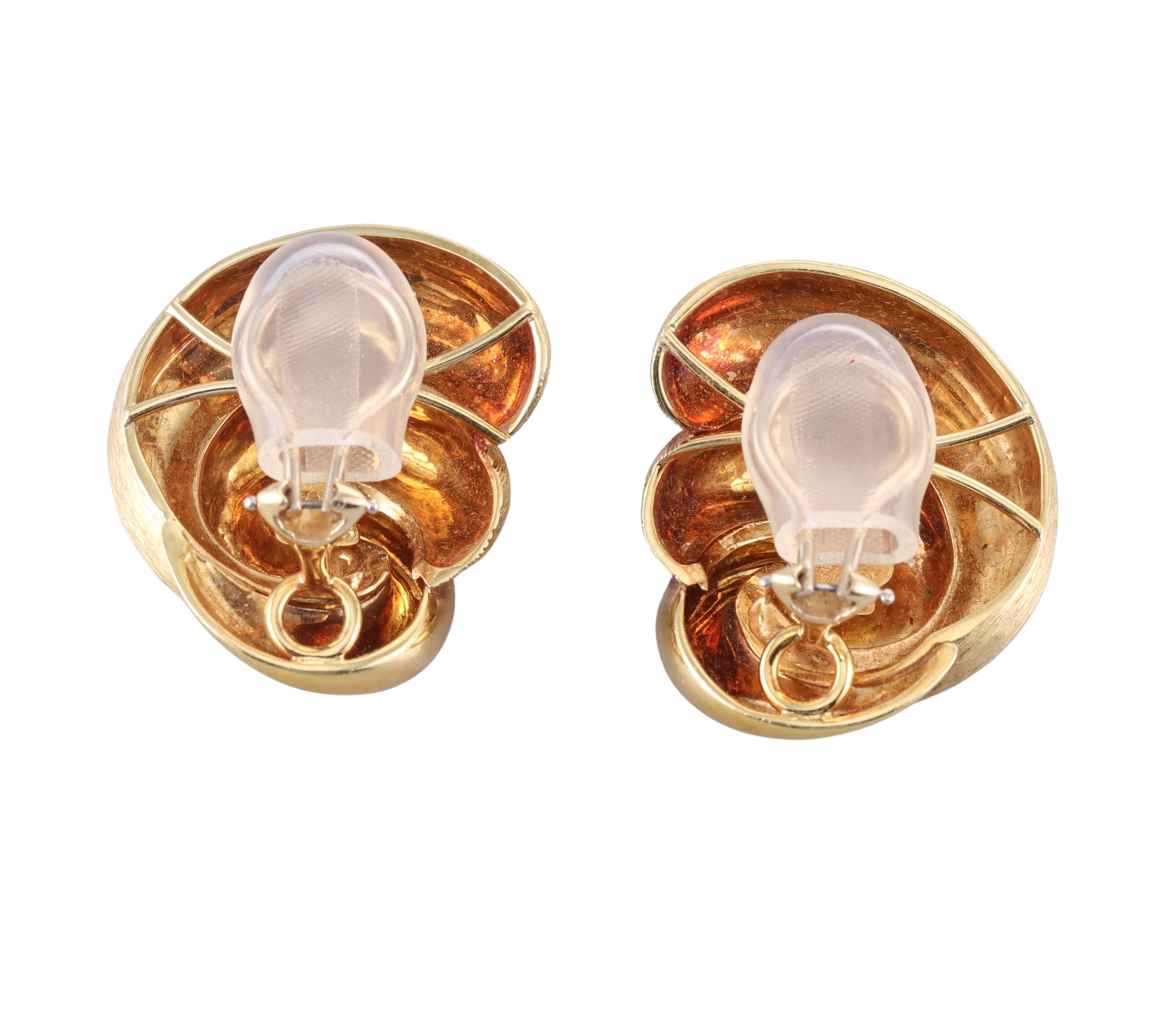Pair of large 18k yellow gold earrings, featuring signature brushed and polished finish in a swirl design. The earrings measure 1.25