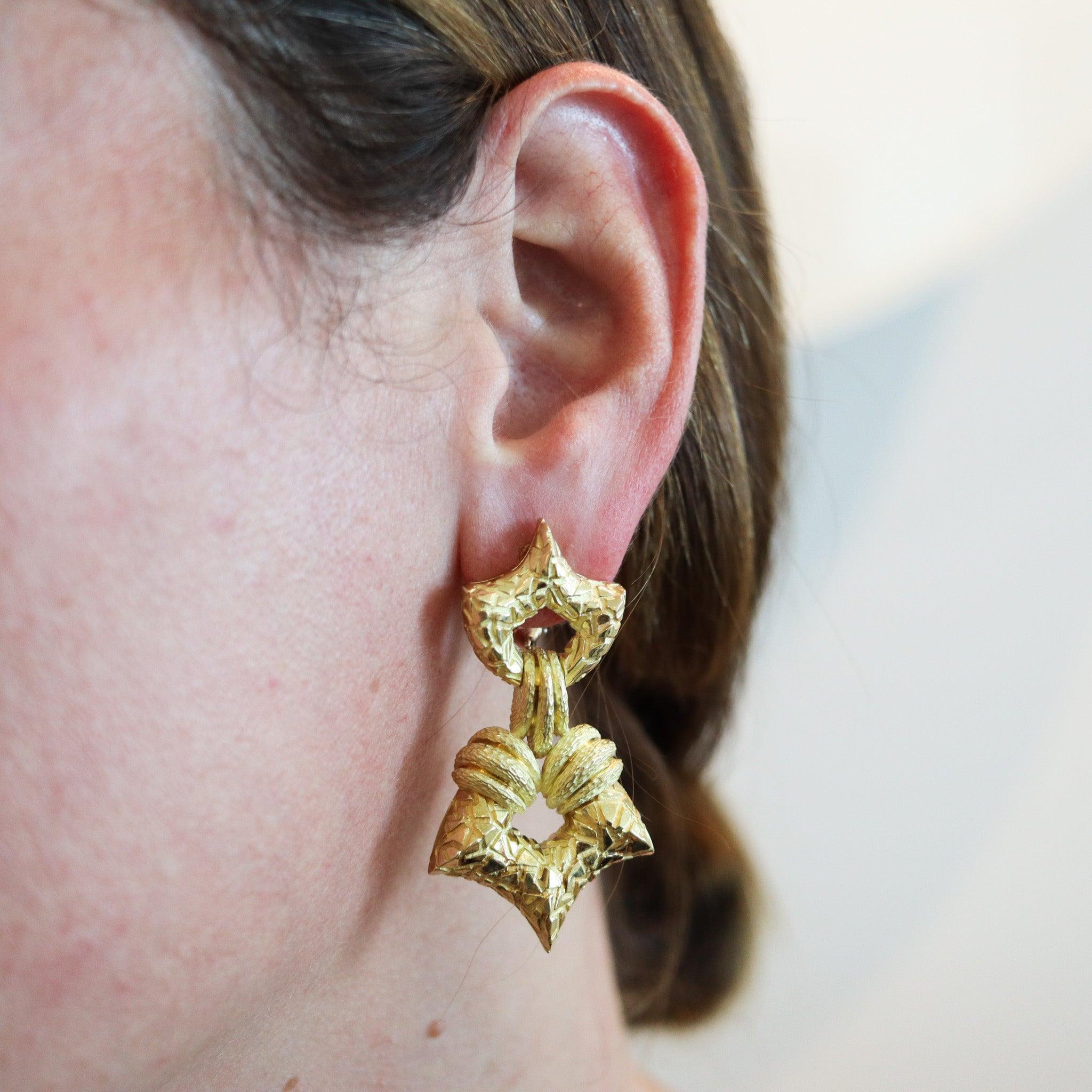 Dangle door knockers earrings designed by Henry Dunay.

Large pair of dangles door knockers earrings, created in New York city at the jewelry atelier of Henry Dunay, back in the 1990. This pair was crafted in solid rich yellow gold of 18 karats and