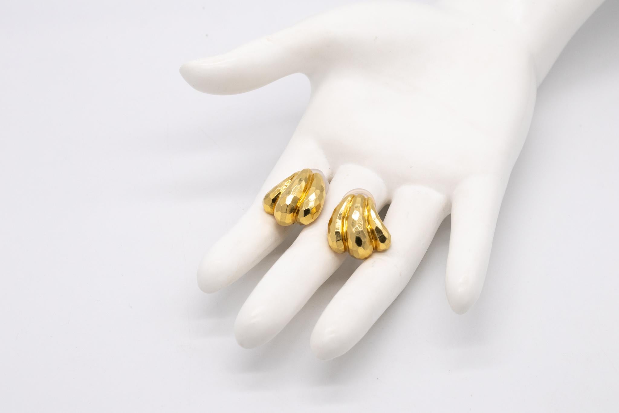 A pair of earrings designed by Henry Dunay.

Great hammered (Faceted) ear-clips, created in the 1990's at the Henry Dunay atelier in New York city. They are totally crafted in solid 18 karats yellow gold and the entire surface is finished with the
