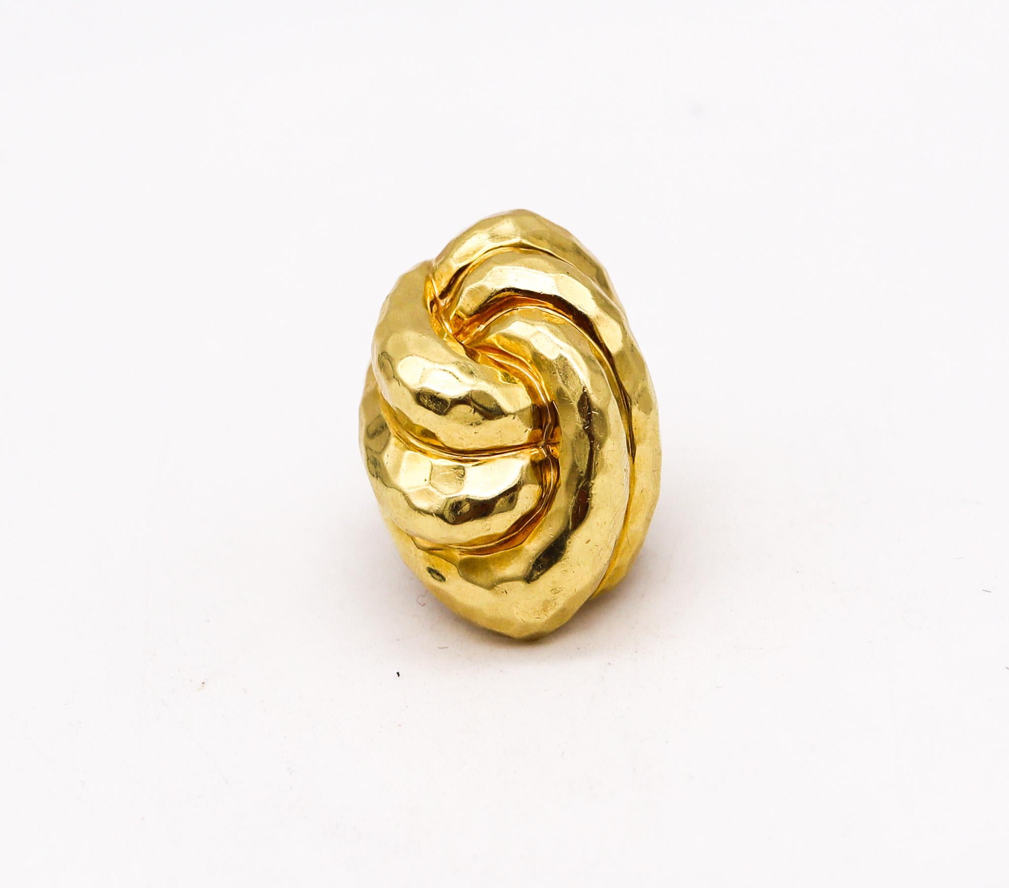 Cocktail ring designed by Henry Dunay.

Bold cocktail ring, created at the atelier of Henry Dunay in New York city, back in the 1990. This piece was crafted  in solid yellow gold of 18 karats with the entire surface finished with the iconic faceted