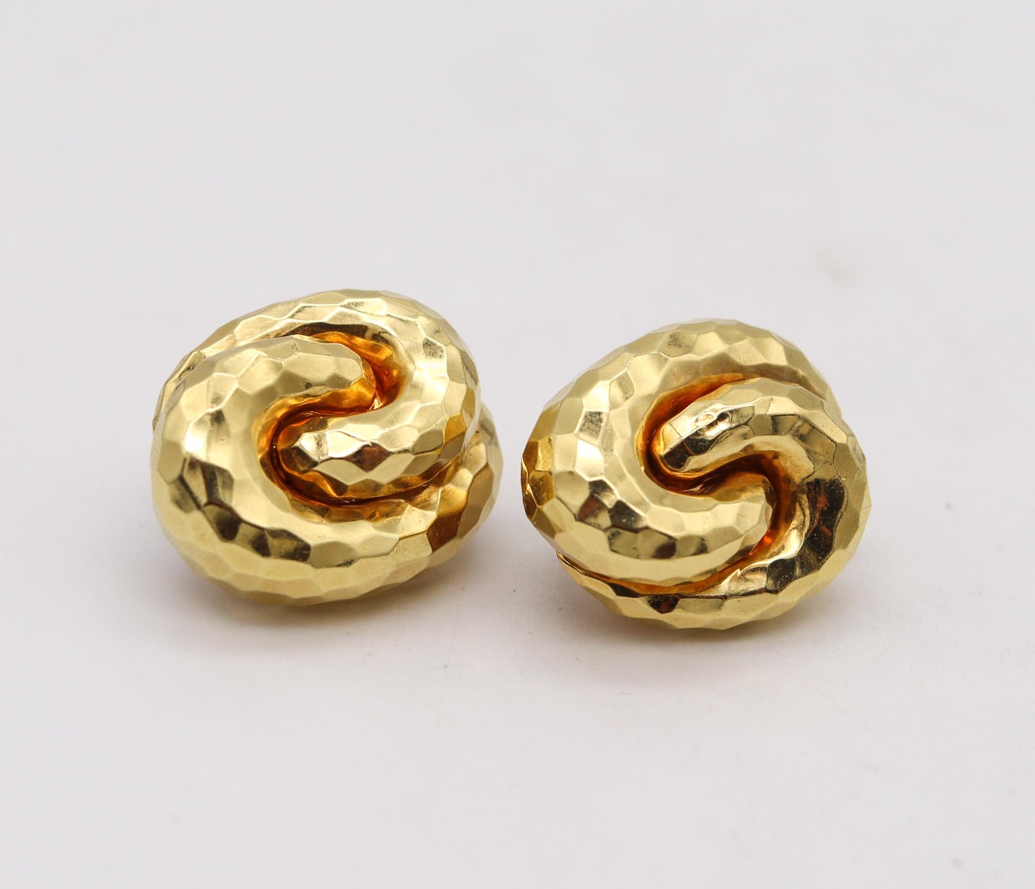 Clips earrings designed by Henry Dunay.

Beautiful bold ear-clips, created at the atelier of Henry Dunay in New York city, back in the 1990. They was crafted as a left and right in solid yellow gold of 18 karats with the entire surface finished with